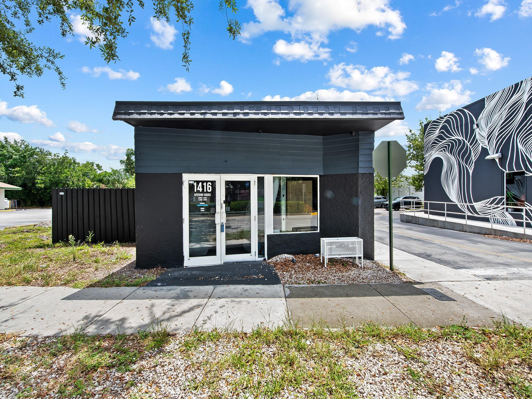 Located on N.E. 4th Avenue in Fort Lauderdale's Studio City neighborhood, this freestanding retail/office property offers a prime opportunity in one of the city's fastest-growing commercial corridors. Positioned between Flagler Village and Wilton Manors, the property benefits from strong visibility, prominent signage opportunities, and consistent traffic exposure. The building features a private outdoor area suitable for customer engagement, events, or flexible business use, along with convenient on-site parking for customers and employees. Surrounded by popular retailers, restaurants, and lifestyle businesses, the property sits within an area experiencing significant redevelopment and investment, providing businesses with exceptional exposure and long-term growth potential.