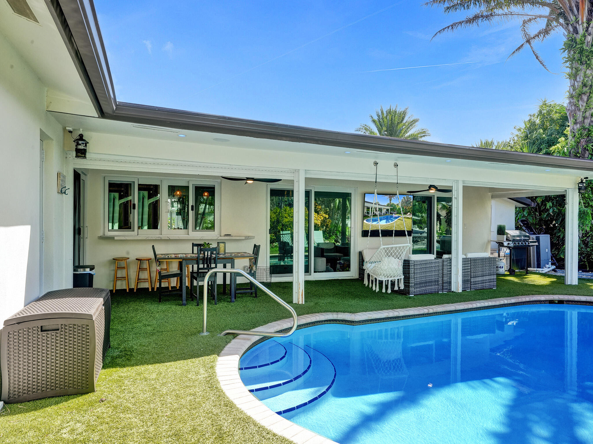 Rare opportunity to own a true 5-bedroom waterfront home in one of Lighthouse Point's most desirable locations. This home offers serious value—most comparable 5-bedroom waterfront properties are over $3M. Located just three canals from the Intracoastal, enjoy fast access to open water. The private dock fits up to a 35-ft boat—ideal for new or recreational boaters. With 45 feet of water frontage, you'll love the peaceful setting and canal views. Inside, you'll find a bright and open layout with generous living spaces and seamless indoor-outdoor flow. The private backyard features a pool and tropical landscaping, perfect for entertaining or relaxing with family. All five bedrooms are full-sized, offering flexibility for families, guests, or a home office.