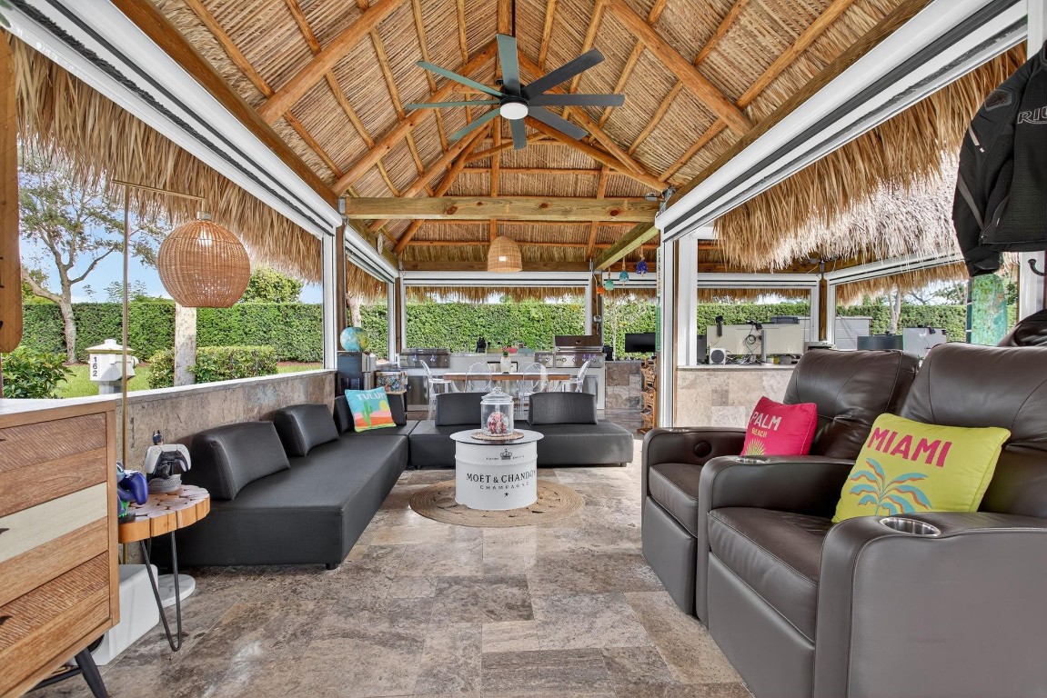 Claim your slice of paradise. Bring your CLASS A motorcoach to AZTEC RV RESORT and settle into the lifestyle you deserve—complete with your own private tiki, perfect for entertaining or unwinding in tropical style. Prime location near beaches, Fort Lauderdale Airport, dining & entertainment. Property features a 4,229 SF lot located in a loop with no rear neighbors, Large L-shaped tiki 30 x 40 with concrete walls and travertine flooring, an outdoor kitchen (Paradise Grill) with cooktop, BBQ, and burner, marble countertop with office/bar section, hurricane-rated screens and shutters, mosquito control system (Swat system), travertine edging around the lot. Newly built in 2023 with permits. Onsite, you will find a state-of-the-art fitness center and a packed calendar of seasonal activities.