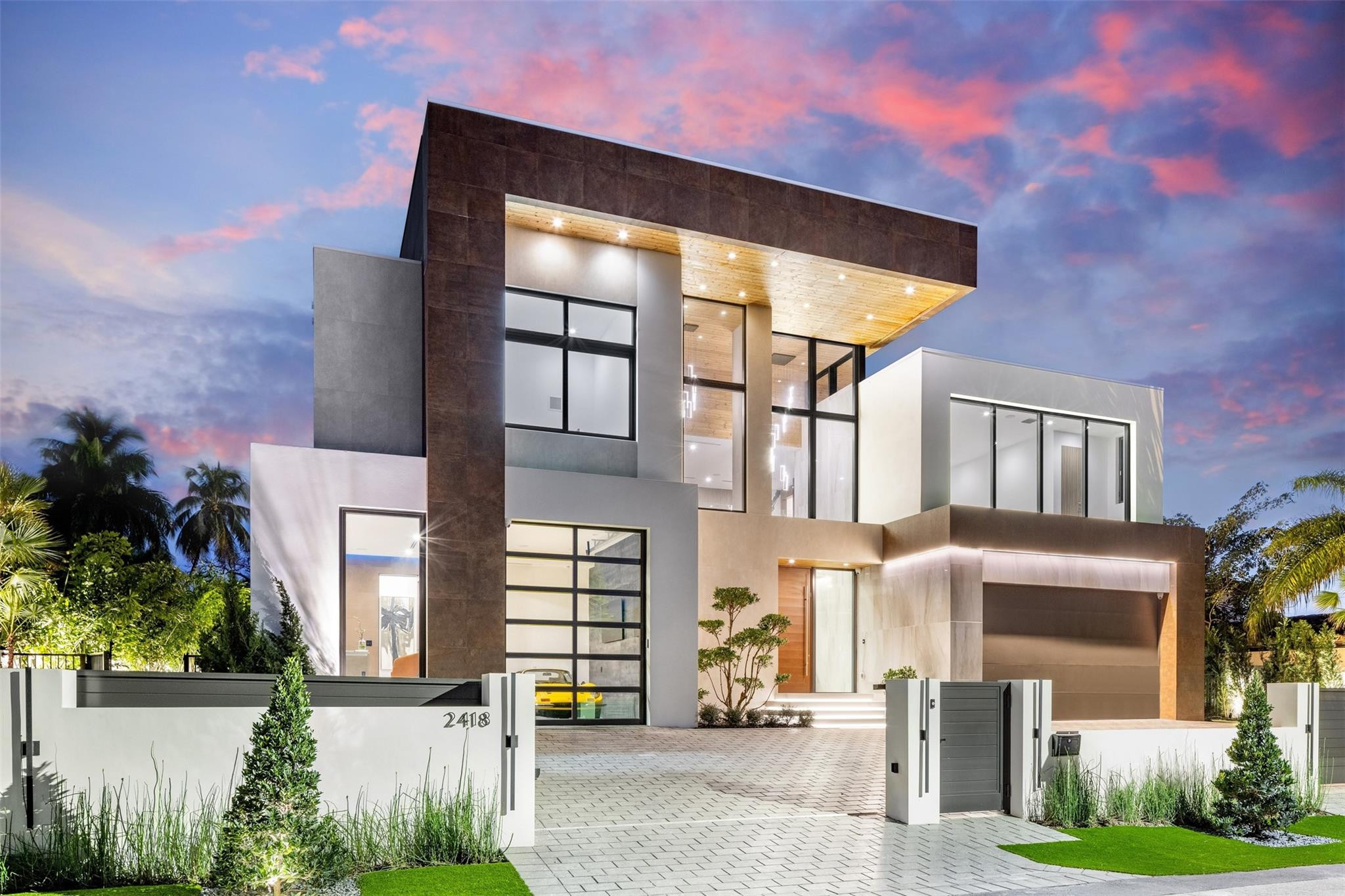 Ultra luxurious waterfront estate sited along a quiet cul de sac in Coral Ridge. Newly constructed and sophistically crafted using the finest materials and finishes. Attention to detail is seen throughout with seamless transitions, hidden doors, creative infinity pool design, and endless water views from most every room. Equipped with an elevated 54 foot powered concrete dock, covered outdoor kitchen, and lavish overflowing spa and sun lounge area. Other features include:Italian porcelain wall cladding, custom mill work paneling, 10 foot glass sliders, Wolf/Subzero appliances, Lutron lighting, Sonos sound system, upstairs loft bar, bedroom breakfast bar, walk in Italian closets, office/gym, and custom vanities. .
