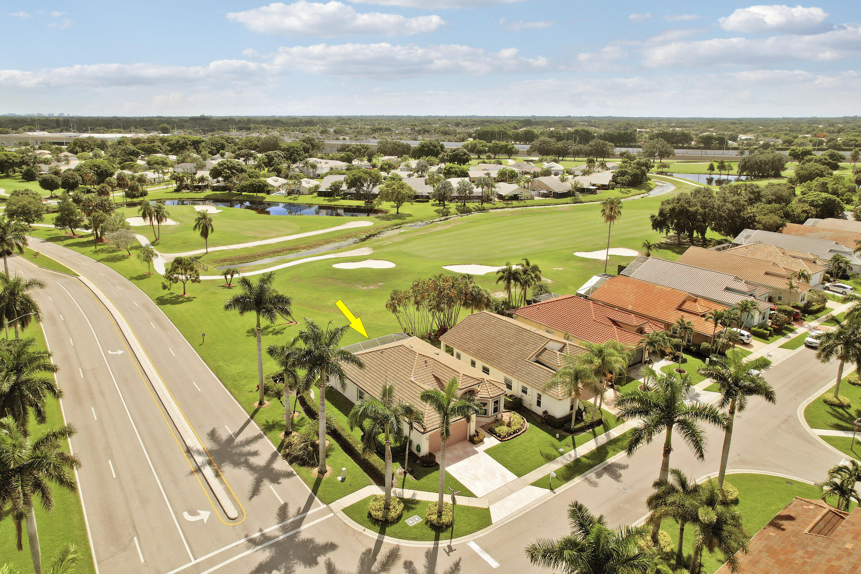 Welcome to this original owner 3-bedroom, 2-bath home in the gated community of Lacuna at Atlantic National. Overlooking the 2nd fairway, this impeccably maintained residence offers soaring ceilings, a split-bedroom floor plan, abundant natural light, and peaceful golf course views from the expansive screened and covered lanai. The spacious kitchen features generous cabinetry and opens to the main living areas. Recent updates include a new 2025 A/C, updated primary bath, full accordion shutters, generator hookup with generator, and meticulous care throughout. Minutes to shopping, dining, beaches, Wellington, PBI, and downtown West Palm Beach.