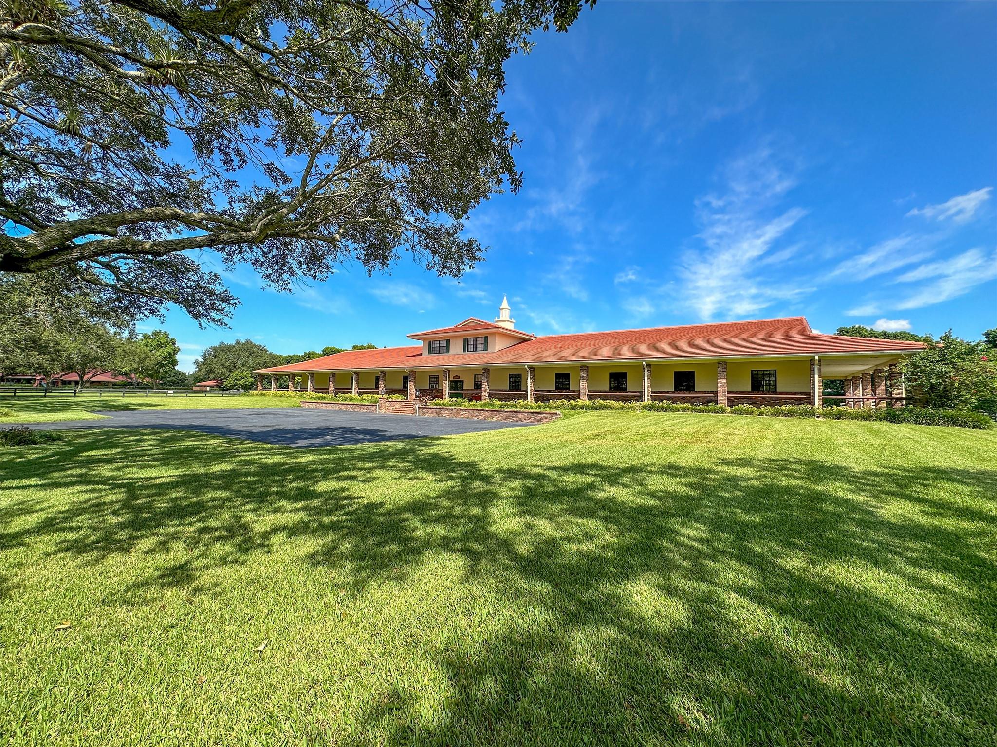 ***HORSE LOVERS GENTLEMEN'S RANCH, THE LAST OF ITS’ KIND...ONCE IN A LIFETIME A PROPERTY LIKE THIS COMES ALONG, BLINK AND IT WILL BE GONE!!!*** A STORYBOOK SETTING ON 15 LUSH ACRES, METICULOUSLY MAINTAINED AND FORTIFIED WITH CHICAGO BRICK COLUMNS,COACH LIGHTS AND IRON FENCING IN BETWEEN. MAIN HOUSE BOASTS 7,003 SQFT A/C AND IS DIVIDED INTO 3 TREMENDOUS BEDROOMS+GAME ROOM, 4 FULL BATHS + POWDER ROOM. GRAND FOYER ENTRY W/ 18 FT TONGUE AND GROVE VAULTED CEILING. 106’ OF WRAP AROUND VERANDA OVERLOOKING THE POOL AND GREEN AREAS. POOL HOUSE 661 SQFT. SHOWCASE CBS BARN W/19 STALLS, FULL BATH, TACK/FEED/LAUNDRY ROOMS. 2ND FLOOR GROOMS QUARTERS-2 BEDROOMS/1 FULL BATH 1,218 SQFT. GREEN AREA IS DIVIDED INTO 9 SPACIOUS PADDOCKS – SIX 110’ X 165’ AND THREE 139’ X 425’.. 768 SQFT GROUNDS KEEP GARAGE.