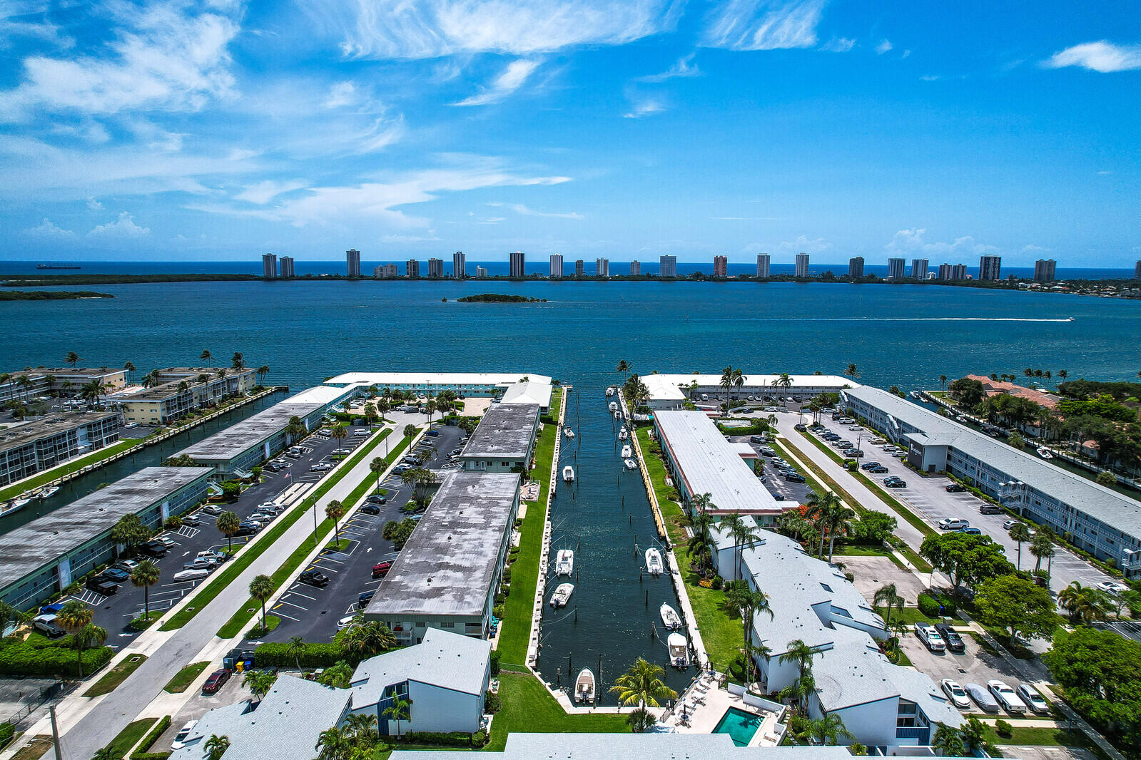 Light and bright Waterfront Condo with beautiful canal and boat views,This spacious two bedroom two bath residence features a large primary suite on the second floor with wonderful water views and a relaxing Jacuzzi tub. The upgraded kitchen opens up to comfortable living spaces. There is a private lanai great for relaxing or gardening. Boaters will appreciate direct ocean access with no fixed bridges and boat docks are available for rent through the Association. Convenient parking right outside the front door. A wonderful opportunity to enjoy the Florida lifestyle with easy assess to boating ,fishing and all that coastal living has to offer