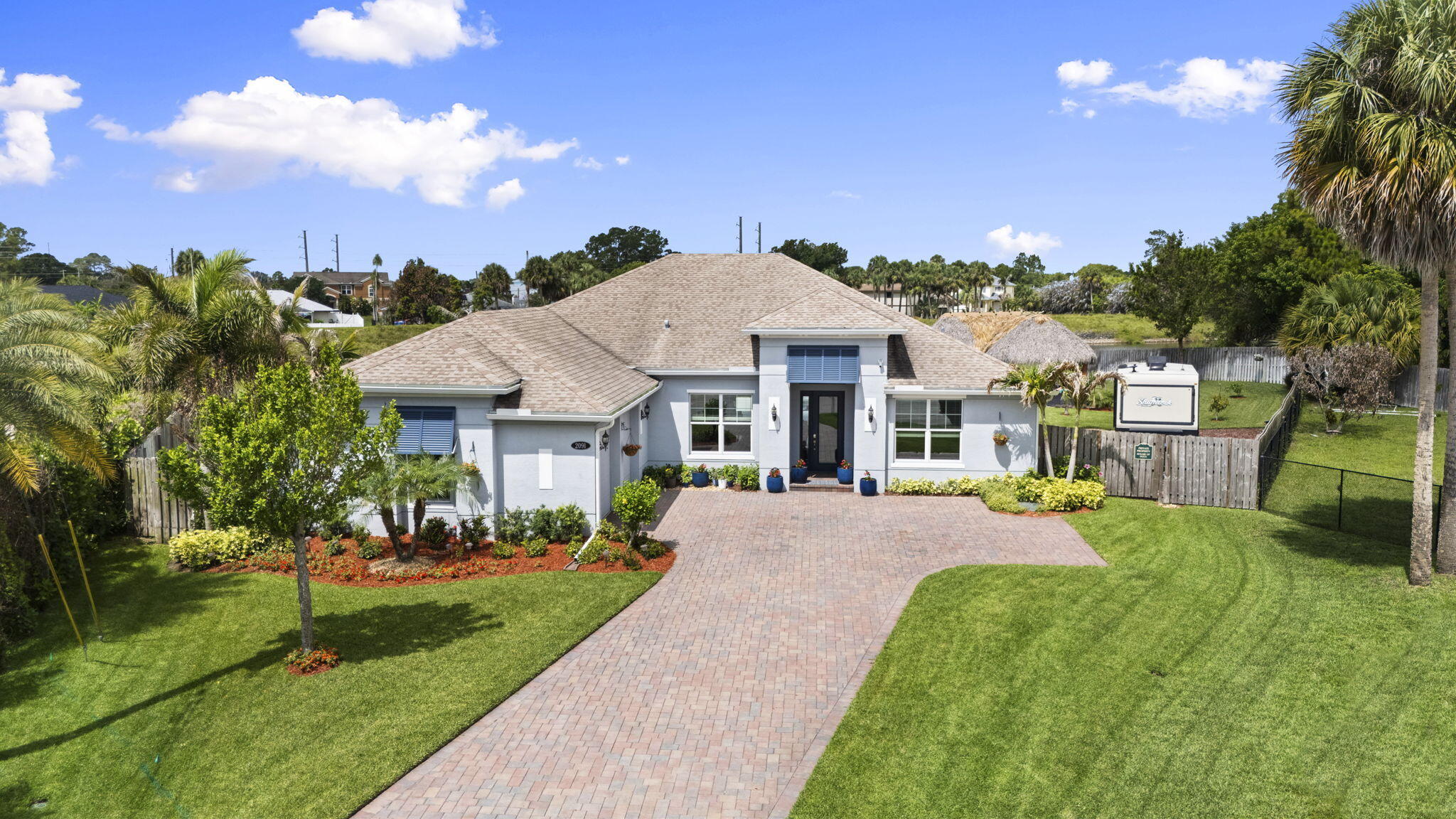 Exceptional 3-bedroom plus flex room (den/office or potential 4th bedroom),3 -bath pool home offering  an oversized fenced waterfront cul-de-sac lot with NO HOA. Built in 2020 and meticulously maintained. Features include impact windows, an open-concept floor plan, upgraded finishes, whole-house water filtration system and a 710 sq ft oversized garage. outdoor living is unmatched with a heated and chilled saltwater pool featuring a sun shelf and spa, expansive patio space, beautifully landscaped grounds and a custom tiki hut perfect for entertaining. additional highlights include a hurricane-rated Tuff Shed,30-amp RV hookup, and driveway parking for up to 10 vehicles. Move-in ready and conveniently located near shopping, and major roadways.