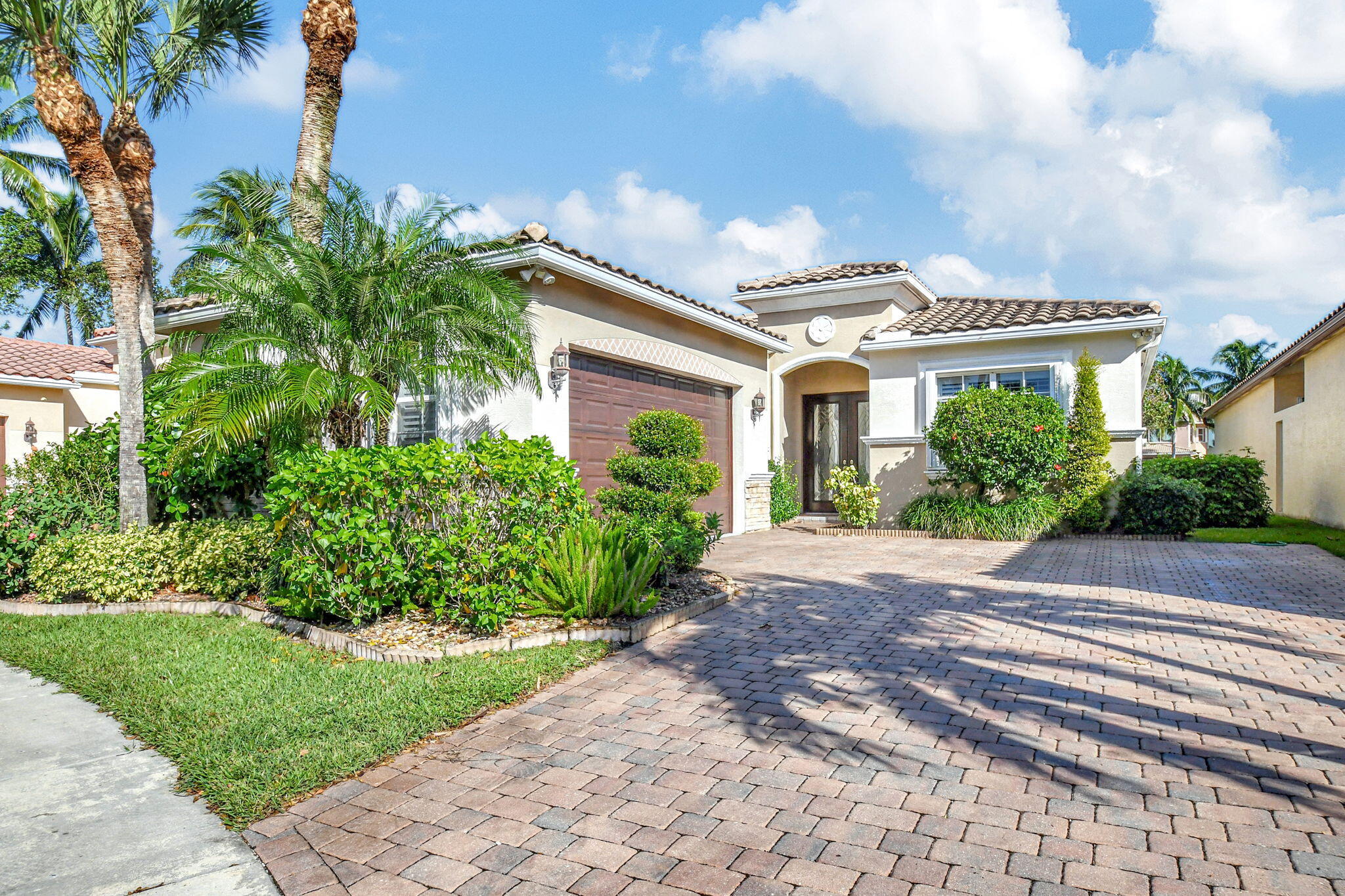 UPDATE:  this home is back on the market due to financing issues. Newer home in the community! 4 BR, 3 BA home has been immaculately maintained by original owner. As you enter the home take note of the front doors which have been customized to include etched glass inserts. Three way bedroom split. One guest room has an ensuite bath. Accordion shutters for storm protection. Plantation shutters on every window and sliding doors. AC replaced in 2022.(4 ton unit). Tile thruout with wood planking in the bedrooms. Designer lighting and custom closet built ins. Gutters installed,microwave replaced in 2020. Side garage entry. Isola Bella Estates is a manned gated community with amenities in an 'A' rated school zone. Close to a prestigious Jack Nicklaus golf course (formerly Sherbrooke CC) ready 2027. Chandeliers in the photos do not convey.