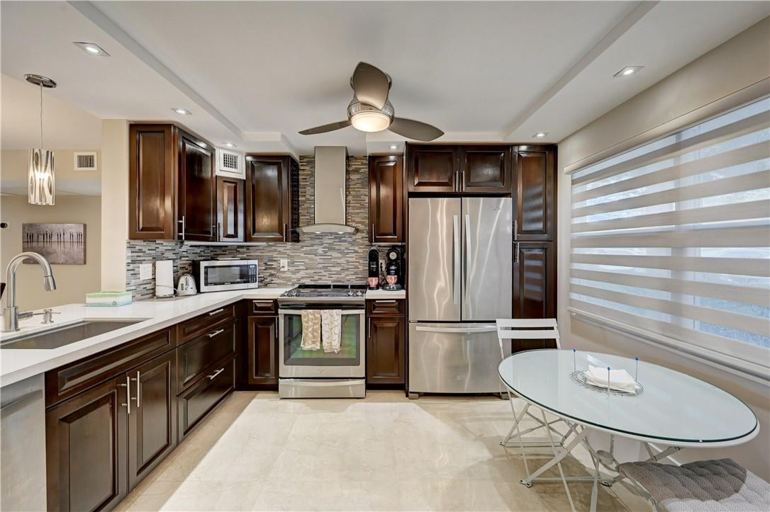 REMODELED ALL CUSTOM DESIGNED BY WELL-KNOWN 'UMBERTO'; LAKE VIEWS* PORCELAIN BUTTED TILE THROUGHOUT*KITCHEN QUARTZ COUNTERS*TOP OF LINE APPLIANCES*FRONT CONTROL SLIDE-IN RANGE. THIS DESIGN ALLOWS YOU TO SHOWCASE A SOLID BACKSPLASH VISUAL WITHOUT BEING BROKEN UP BY A CONTROL PANEL*FABULOUS OPEN FLOOR PLAN*ALL IMPACT WINDOWS*IMPACT GLASS ENCLOSURE WITH DOOR TO YOUR BACKYARD*FRENCH DOORS TO PATIO*IT'S A WORK OF ART*GLASS DOORS TO BEDROOMS*POCKET GLASS PRIVACY DOOR TO BATHROOMS*CUSTOM CLOSETS*FURNISHED TURN-KEY* NEW A/C, NEW WATER HEATER* 55+ GOOD INCOME AND GOOD FICO REQUIRED BY ASSOCIATION Disclaimer:  The information contained in this listing is not verified for authenticity or accuracy and is not guaranteed. This information is provided exclusively for consumers’ personal, non-commercial use and may not be used for any purpose other than to identify prospective properties consumers may be interested in purchasing.  Any photographs contained in this listing are for the sole purpose of showing a basic description and layout of the property and should not be relied on in lieu of an independent inspection of the property.  The consumer is required to independently verify appliances, light fixtures, and/or any other personal property that may or may not be included in the purchase of the property.