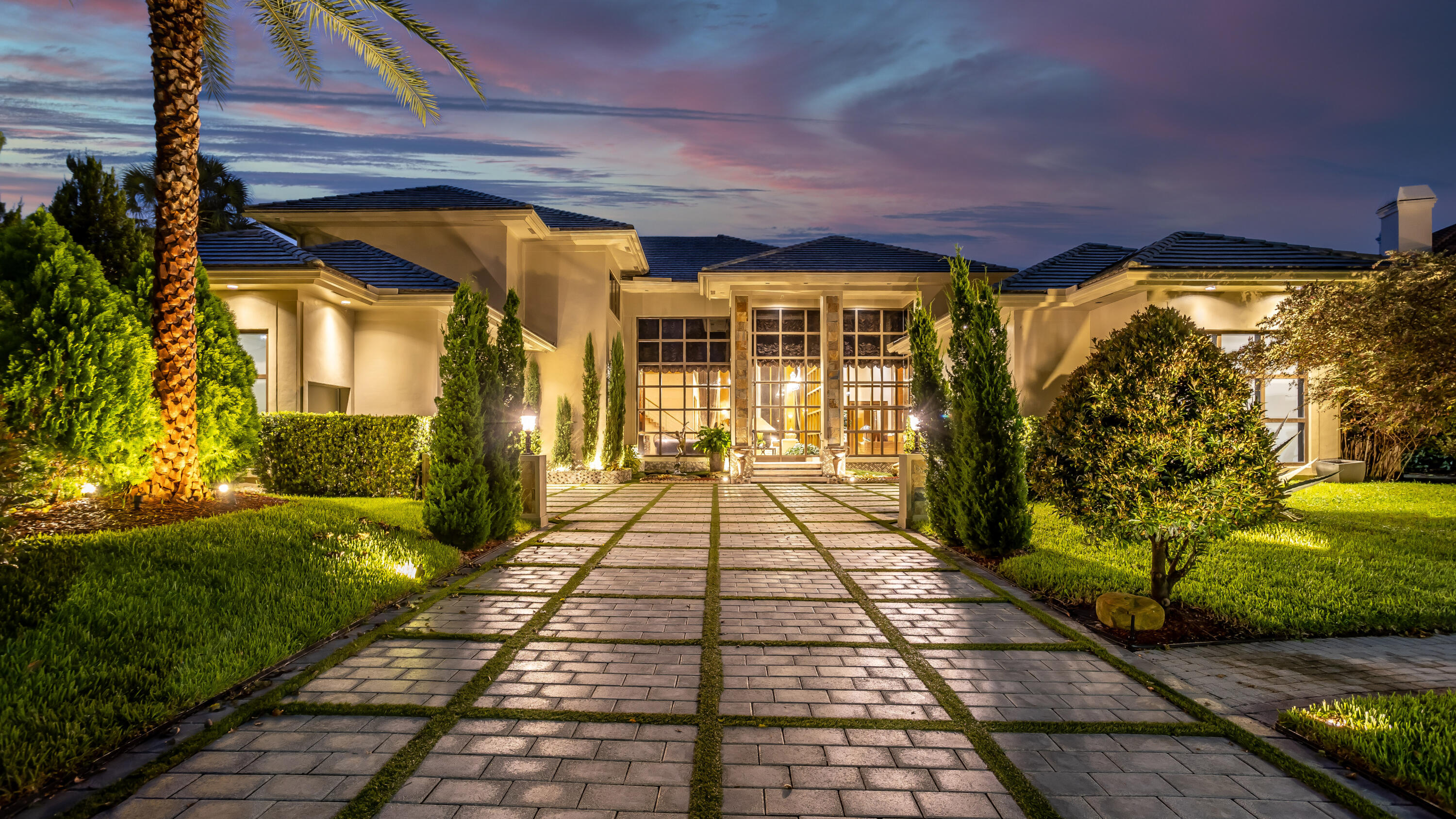 A Frank Lloyd Wright inspired creation of wood, metal and stone, blends with Feng Shui and smart home technology to create this one-of-a-kind estate. Upon entry you are greeted by dramatic two story architectural features and views through a 23-foot glass wall, which overlooks the infinity edge pool, the expansive lake and golf course vistas. The kitchen is a chef's delight, with large center island and utilizing the finest of appliances, including gas cooking and a warming draw, all framed in simulated Colorado river rock. The focal point of the large breakfast room is a huge 8 foot by 6 ft aquarium also framed in the river rock The breakfast room overlooks the family room which is completely encased in glass windows  and ceiling which showcases the privacy with expansive views of the pool and patio, complete with BBQ area, and the incrediblviews of the lake and golf course. The first floor primary bedroom suite has no equal with a very spacious bedroom with high ceilings and appointed with the finest of materials. They include gorgeous built-ins and electric blackout shades that open to large picture windows and the incredible views. There are three very large walk-in closets finished with the finest of woods.  The bathroom has three distinct areas. The first features the gentleman's bathroom with water closet, separate shower and vanity next to his spaious walk-in closet. The next two areas  are for the Lady of the house. In addition to the sink, vanity,   watercloset, makeup station, dressing mirrors and shower,  there is a wonderful bathtub that overlooks a private lushly landscaped garden with a waterfall.   Additionally there is a private dressing room which features a glass ceiling to bring in the natural light, a make up table, and abudant mirrored closet doors. If you are looking for the finest of bathrooms, you just found it!.
Completing the first floor is a guest bedroom suite, an elegant 
powder room, a large laundry room, as well as acoustically designed home theater with a projection tv and large screen. Upstairs are two lovely bedroom suites and a very large loft area that includes a large sit-down bar, complete with refrigerator and icemaker, as well a spacious sitting area perfect for cards or entertaining and a pool table that and overlooks the glassed in family room and living room. There is also a large deck overlooking the views. There are 2 separate two-car  and a half garages, one  of which also has a separate garage for the golf cart. All four garage spaces have soaring ceilings high enough to install lifts that will then accommodate 8 cars.
This home is must to see, and clearly is one of the most unique and finest homes St Andrews Country Club has to offer. 
In summary, this estate seamlessly combines architectural elegance, natural beauty, smart technology, and luxury amenities to create a one-of-a-kind living experience in the sought-after Lake Estates section of St Andrews Country Club. It's a true showcase of sophistication and comfort.  


4 car garage
2 golf cart garages
Built in speakers 
Creston lighting system
All artwork and electronics are negotiable

Decorative 5 x5 pavers with Grass 
Front entrance fountain 
Decorative pond
Bronze statutes convey
Entrance pillars with Travertine and glass mosaic tile

Dramatic floor to ceiling Glass entrance 

Generac generator - full house
6 Air conditioners

Garage 
Epoxy floor 
Storage shelving 

Utility room
Maytag washer and dryer
Wooden cabinets 
Stainless steel sink 

Bedroom suite 1
Hardwood floors

Marble throughout 

Formal dining room 
Built in wooden and fabric armoire and credenza

Living room 
Decorative bar with wooden detail 
Glass shelves

Indoor small garden 

Great room
Wooden coffered ceiling
Gas fireplace with Hood 
Kitchen
Wooden and glass cabinets
2 sinks
2 islands 
Sharp microwave
Thor 6 burner and griddle 
Thermador hood
Thermador warmer 
Dishwasher
Storage cabinets
Built in aquarium 
Stone wall 

Large breakfast area 

Family room 
Glass enclosure 
Tinted
Ceiling fan 
Built in TV to granite counter island 

Pool 
Infinity edge 
Turf grass

Home theater 
Screen 
Sound proof 
Carpeted 
Built in storage 
Panamax home theater coordinator

Office
Glass enclosed office
Wooden built ins and built in desk 
Glass built in shelves to ceiling

Primary 
Electronic shades
Built in dark wooden shelves 

Walk in closet
Custom built
Fabric wall 

Primary bath 
Room
Closet connect to bathroom
Walk in shower
Waer closet
Vanity 
2nd vanity 
Granite tub looking over man made waterfall feature
Large walk in shower
Glass frameless door
2nd water closet 
Stand up built in mirror 


3rd walk in closet
Vanity closet
With vanity desk
Hollywood style lighting
Mirrored dressing room 
Glass ceiling 

Wooden and carpet stairs with stainless steel wire rails

Entertainment loft
Built in bar
Granite counter top
Mini fridge
Scotsman fridge
Subzero ice maker
Bosch dishwasher 
Sink
Wood ceiling 
Leads to balcony overlooking golf course

Bedroom 3 & 4 suites
walk in closet
Plantation shutters


Garage turned into exercise equipment
Can have lifts if needed