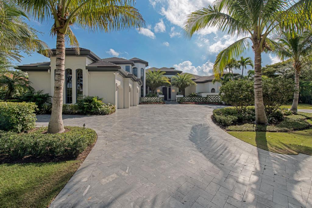 Don't miss this stunning waterfront estate in exclusive Admiral's Cove. Boasting over 96' of water frontage in one of the most prime waterfront locations seconds to the intracoastal. As you enter the grand foyer, you are greeted with waterfront views through floor to ceiling windows creating a comforting bright and airy space. An entertainer's dream with a Chef's Kitchen complete with SZ appliances, coffee station, bar area, additional ice maker, wine coolers and custom storage. First floor expansive master bedroom with his and hers custom closets vanities and showers! Three additional suites in the main house and a one bed guest house overlooking the over sized pool and neighboring yachts. Upgraded everywhere from new roof to hurricane impact widows! Designer furnishings included!