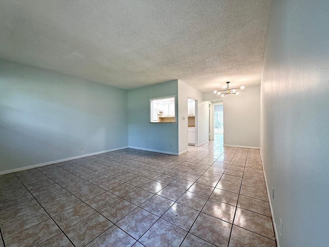 Peaceful & Lovely! For rent in 55+ Century Village! Enjoy the Ease of FIRST FLOOR Living in this Nicely Maintained 1/1 Condo. Neutral Tile Flooring Flows Throughout. Kitchen Features Newer Appliances. Full Bath With Updated Vanity and a Tub/Shower Combination. Bedroom Has A Garden View, Neutral Tile Flooring, and Access to the Enclosed Lanai. Freshly painted and ready for you to enjoy the amenities of Century Village.