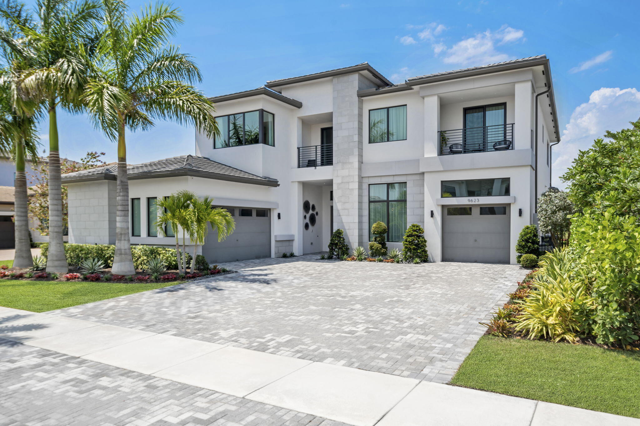 Welcome to paradise living at its best in the sought-after Boca Bridges development in Boca Raton. This rare Veneto Modern home offers the best open floor plan, spanning a total of 7,939 sq ft. With stunning lake views and complete privacy, this home provides a tranquil oasis within an active community.

Featuring 5 bedrooms and 7 bathrooms, this home is designed for comfort and luxury. The main floor boasts a primary bedroom, office, living room, dining room, family room, and one guest bedroom. Upstairs, you'll find a media room, loft, and three en-suite large bedrooms.

Step into the breathtaking backyard, where you'll find a huge brand new resort-style saltwater pool with a large champagne spa, gas fireplace, marble and turf deck, spacious sun-shelf, swim-up benches, and a one-of-a-kind lounge area with plenty of seating. The summer kitchen is equipped with a wine cooler, double refrigerators, grill, and speakers, making it perfect for entertaining.

This 2-story masterpiece is filled with every amenity you can imagine. The main areas feature gorgeous porcelain flooring, while the bedrooms are adorned with wooden flooring. The kitchen is a chef's dream, upgraded with high-end Subzero, Wolf, and Bosch appliances, double islands, and a water filtration system for the entire house. Custom wall and ceiling work add a touch of elegance throughout the main living, dining, entrance, loft, and office areas. Custom drapes and Restoration Hardware lightings enhance the ambiance of the house.

Entertainment enthusiasts will love the custom media room, complete with a 150-inch screen and Klipsch speakers. The smart Lutron Home System adds convenience and control to your fingertips.

The prestigious community of Boca Bridges offers an outstanding range of amenities for its residents. The 27,000 sq ft lifestyle complex includes an elegant lounge with a bar, card room, game room, and indoor sports area. Stay active with fitness facilities, swimming pools, tennis courts, and pickleball courts. There are also activities for all ages to enjoy.

Don't miss out on the opportunity to experience luxury living in Boca Raton's most sought-after development.