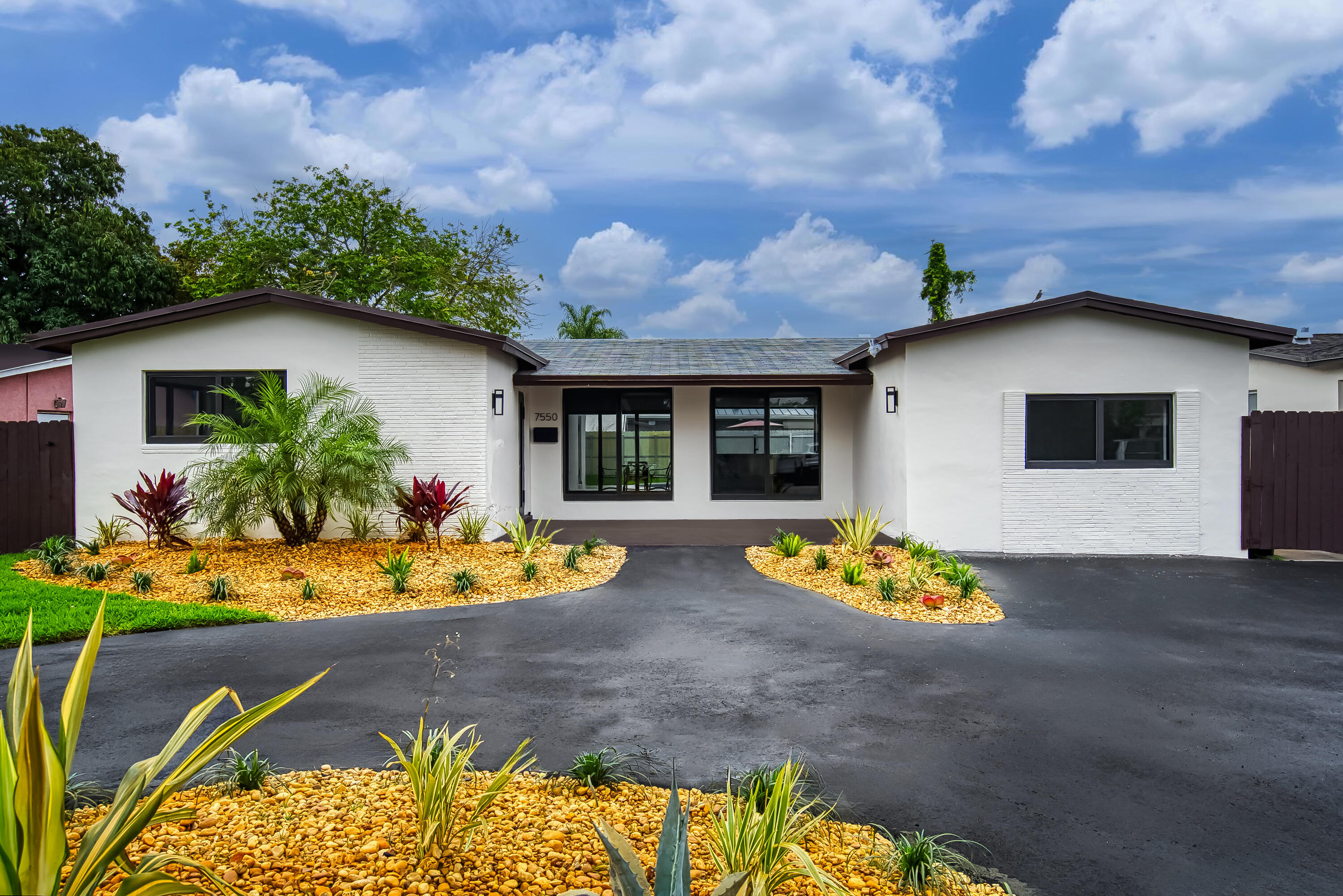 Beautifully updated 4-bedroom, 2-bath single-family pool home in the heart of Miramar featuring a spacious split floor plan and open layout filled with natural light. The home showcases modern designer finishes, new luxury plank flooring throughout living and bedroom areas, and updated appliances for a fresh, contemporary feel. Natural gas is available for added efficiency. Enjoy generously sized bedrooms and a private backyard oasis with pool, perfect for relaxing or entertaining. A circular driveway adds ample parking and curb appeal. Centrally located with easy access to beaches, Hard Rock Stadium, and Hollywood Young Circle, plus major highways, shopping, dining, parks, and schools. Move-in ready in a well-established neighborhood.