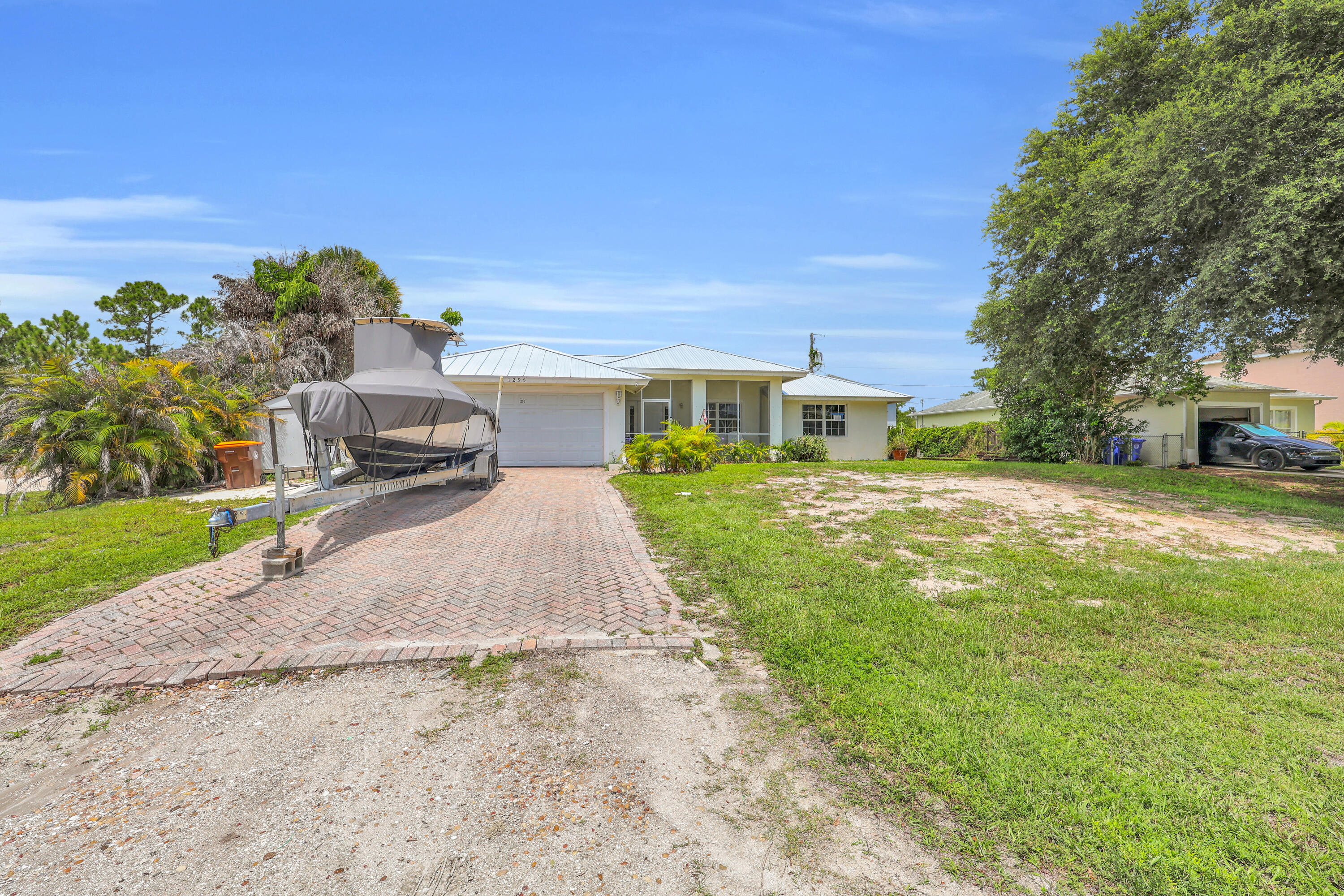 Move right into this well-maintained 2005 CBS home featuring a desirable split-bedroom floor plan with 3 bedrooms and 2 bathrooms. Major updates have already been done for you, including a new 2026 metal roof, 2025 A/C, and 2025 water heater.  Inside, you'll find tile and laminate flooring throughout—no carpet! The interior has also been freshly painted, including the ceilings, walls, and doors, giving the home a clean, fresh feel.  Conveniently located just minutes from downtown Vero Beach, beautiful beaches, shopping, dining, and everyday conveniences, this home offers the perfect combination of comfort, convenience, and value. Whether you're looking for a primary residence, seasonal getaway, or investment property, this one is ready for its new owner!