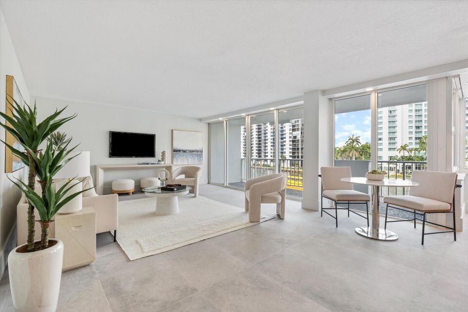 Experience the best of South Florida waterfront living in this completely updated condo offering a spacious open-concept floor plan and stunning direct Intracoastal views. Enjoy breathtaking sunrises, endless boat activity, and picturesque water vistas from the comfort of your home. Thoughtfully renovated throughout, this residence features impact windows and doors, modern finishes, and an abundance of natural light. Ideally located east of the bridge, you're just minutes from the beach, waterfront dining, shopping, and entertainment. The building is well-maintained with no upcoming assessments, and all current assessments have been paid in full. Move right in and start enjoying the coastal lifestyle you've been dreaming of.