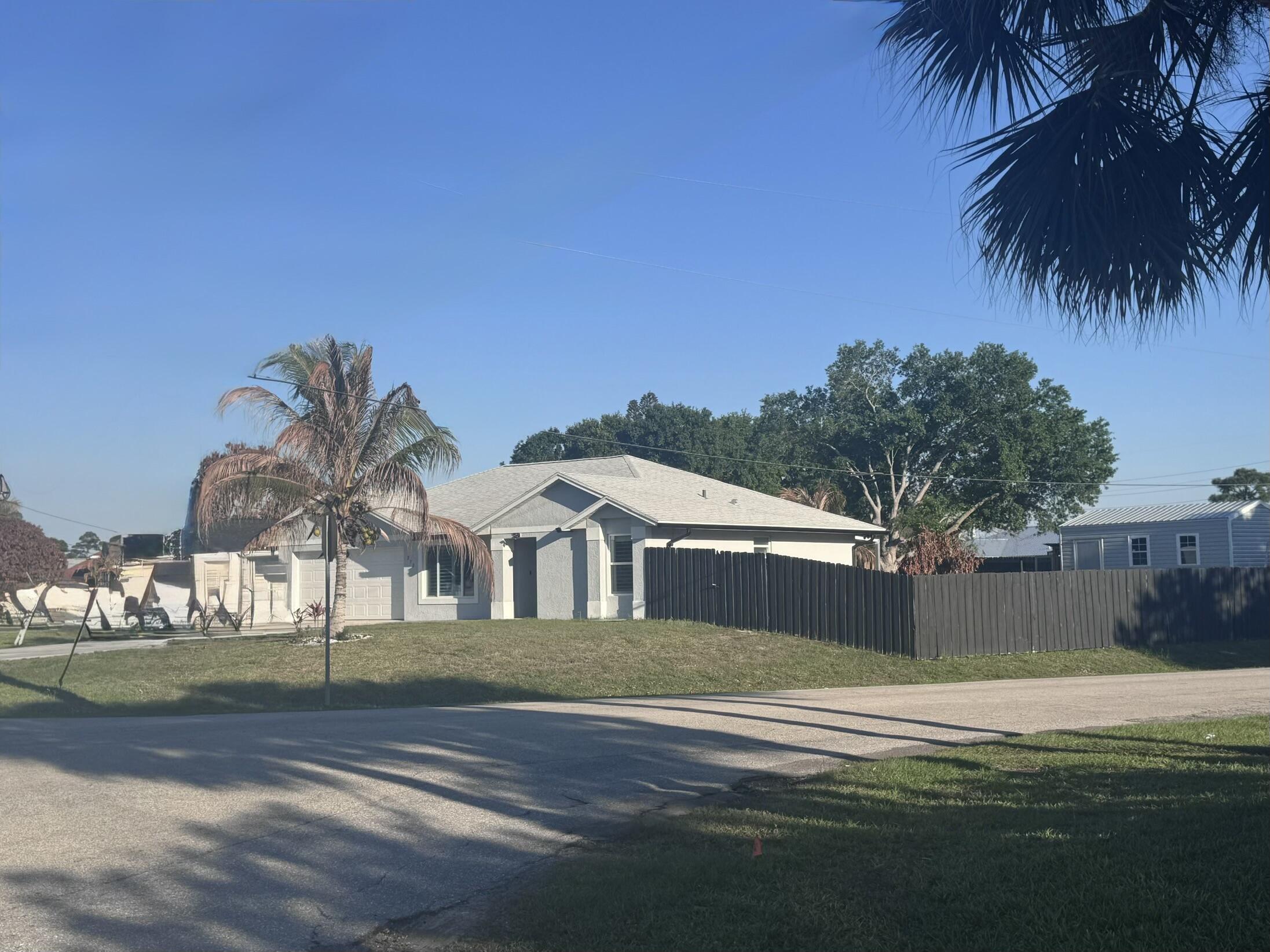CBS home 3/2 located on a large corner lot!  Split floor plan, spacious fenced backyard.  Home features porcelain tile floors throughout the home.  All windows are hurricane impact glass, the backyard features a large, covered patio.  Home is centrally located, close to turnpike, close to shopping and restaurants.  There is plenty of room for get togethers in the spacious backyard.  Owner will leave the large storage shed; shed is permitted.  All new gutters around the house. Large Corner lot! Come by and take a look!! Bring your R.V. and park it on the side of home or in your fenced backyard!!!  Owner must check with City for rules and regulations.