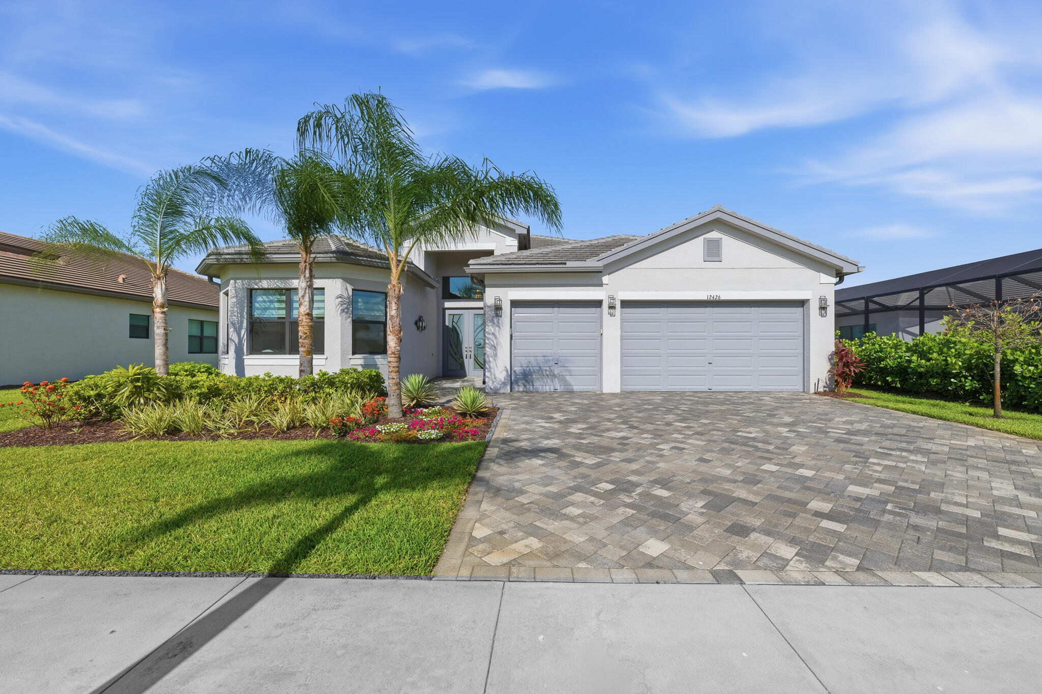 Welcome to this stunning Julia model in the prestigious 55+ community of Valencia Walk at Riverland. Offering 2753 square feet of thoughtfully designed living space. This well-maintained home features soaring ceilings and upgrades throughout. Enjoy the expansive water view from the primary master suite, cafe seating area in the kitchen and the screened-in patio. Riverland's active-style living features a spectacular 34,000 square foot clubhouse, state of the art fitness center, resort style pool, cafe with indoor and outdoor dining, card rooms, sports lounge and miles of pathways on which to ride your golf cart, ride your bicycle or just take a daily walk. Here is a rare opportunity to enjoy luxury living without the wait for new construction.