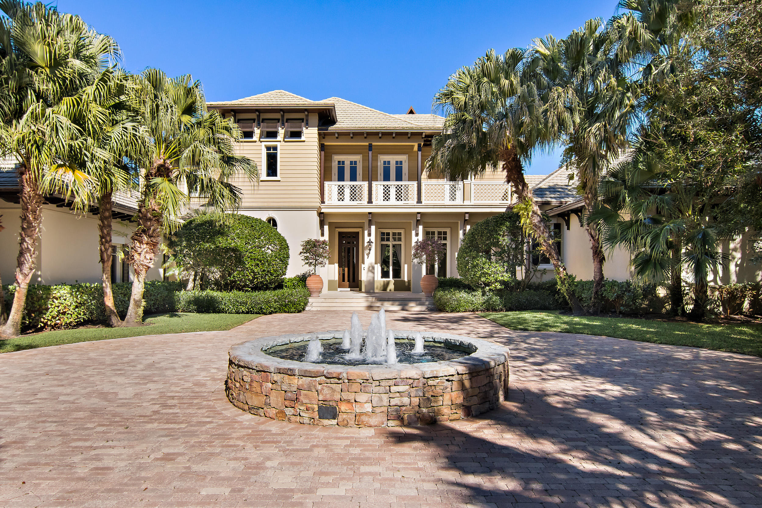 Offering exceptional views of 10th and 11th holes of the Jack Nicklaus Signature golf course at The Bear’s Club this four bedroom, five full & one half bath residence offers nearly 6,700 ac/sf of living space. The home also features a large paneled library and a combination billiards/club room located off of the family room. This Lavelle Construction built residence offers West Indies inspired exterior elevations with clean transitional interiors.  The property totals 1.22 acres with a large rear yard and pool area providing allowing for both golf views and privacy. The lot offers ample remaining footprint to add additional square footage.
