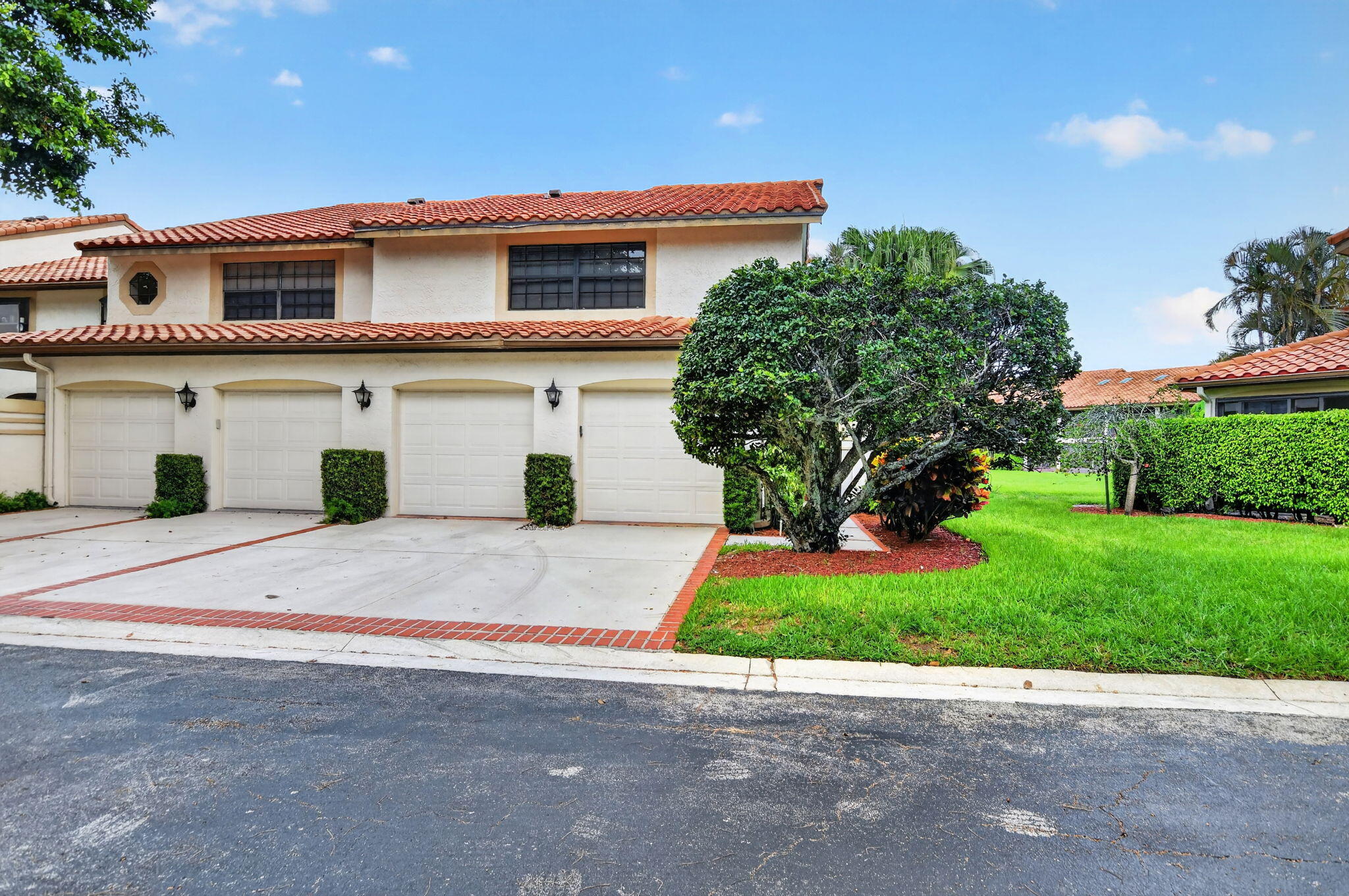 Great opportunity to own this spacious townhome in desirable La Mirada at Boca Pointe. Offering approximately 2,000 square feet of living space, this well-designed floor plan features 3 bedrooms, 2.5 baths, a formal dining room, large living room, fully enclosed patio providing additional living space, and a 2-car garage. The kitchen was beautifully updated in 2023 with white cabinetry, quartz countertops, stainless steel appliances, and a subway tile backsplash. Engineered wood flooring enhances the main living areas downstairs. Updated powder room and refreshed upstairs baths with replaced countertops add to the home's appeal. Separate laundry room with front-loading washer and dryer. Enjoy tranquil pond and garden views from this ideally located home close to the community pool.