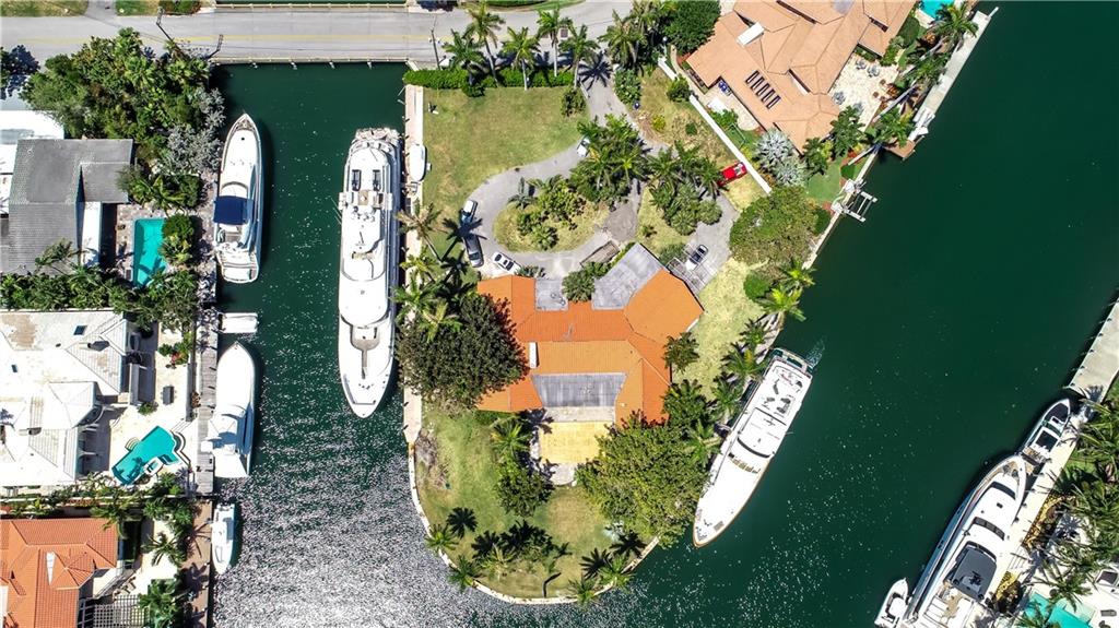 PRIVATE, 555' WATERFRONTAGE PENINSULA! PRIVATE BEACH MEMBERSHIP! Do not miss this once in a lifetime opportunity to own this exception Harbor Beach estate that is the ultimate Yachtsman's dream with waterfrontage on three sides. This 40,809 sq. ft. parcel of buildable land boasts an incredible 555' all dock able waterfront for your OCEAN GOING YACHTS! Two gigantic Turning Basins and property has 3 Phase Power, 240, 2 meters, (2)100 amps, Single Phase Power for your yachting needs. Idyllically situated on the East point of the Diane & Gordella Rivers in the sought-after Laguna Isles section of Harbor Beach gives one the feeling as you enter the front gates that you are on a small private island. Build your ultimate new dream home on this premier rare jewel of a property!