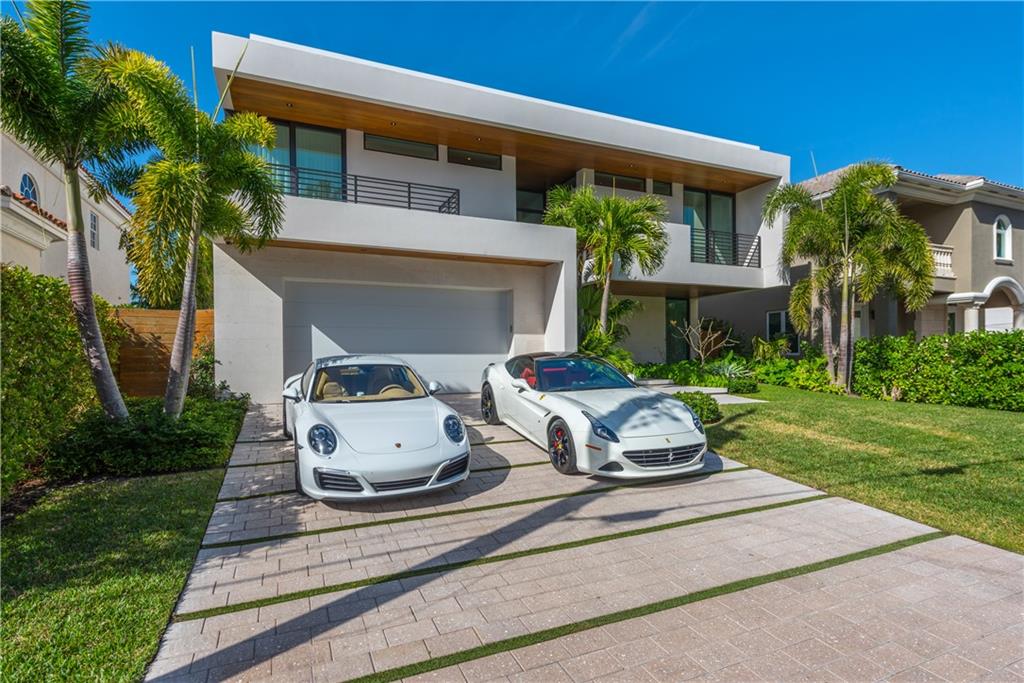 Stunning modern newly built waterfront home completed by Zahn Development in the Riviera Isles. Architecture by Hugo Mijares of One D+B offering a tropical contemporary style, along with warm stone and specialty wood textures throughout the home. Massive ceiling height, oversized rooms, modern chefs kitchen, and a stunning master suite make this a best of the best. Smart home automation, porcelain floors/ floating stairs, custom tiki hut and extended concrete patio/dock make this a boaters dream.