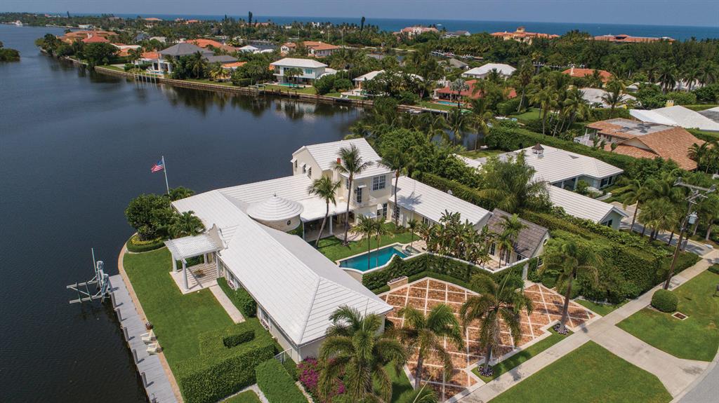 Elegant Island Oasis. The sensational estate underwent full renovation in 2003 and designer updates in 2016, This modern residence presides an expansive corner lot that showcases views of Lake Worth featuring premier yacht dockage with a 5,000 pound vessel lift. Point Manalapan is a guarded collection of estates that attracts elite residents for its privacy and lush waterways. Residents who reside on Point Manalapan inherit an exclusive membership to La Coquille Club at the Eau Palm Beach Resort & Spa. The information herein is deemed reliable and subject to errors, omissions or changes without notice.  The information has been derived from architectural plans or county records. Buyer should verify all measurements This Bermuda-style estate is centered on the ultimate oasis. Residents can unwind with a swim in the luxurious pool, prepare a meal in the summer kitchen, and end the evening with a poolside gas-lit fire. This stately splendor is marked by extensive amenities offering endless entertainment conveniently inside of the artistic showplace for residents and their guests. Sprawling water views from a private sundeck, the Master Suite is the pinnacle of relaxation encompassing the entire second story of the estate. This 6-bedroom residence includes a cabana room yoga studio, a 600-bottle wine cellar, and a theatre room. 


Location: 
Audubon Causeway, Manalapan, Florida.  Hidden away in Old Florida serenity, Point Manalapan is an exclusive guard-gated enclave on Hypoluxo Island, surrounded by the Intracoastal Waterway, with the ocean beach just across the causeway.  Manalapan residents enjoy deeded privileges at the Five-Diamond Eau Palm Beach Resort & Spa and its La Coquille Club.

Property: 

This grand estate designed by world-class architect John Volk for artist, Orville Bulman, presides 258± square feet of wraparound water views and is equipped with a 5,000± pound vessel lift. Greeted by coastal garden appeal, the courtyard walls are immaculately covered in manicured basketwoven vines. Welcoming guests into the courtyard sanctuary is a refinished heated pool with a spillover spa surrounded by turf grass. Under a covered loggia is a resort-style summer kitchen, bar, and gas fireplace for the connoisseur. 

Residence: 

Inspired by Bermuda-style, this spacious property totals 7,918± square feet with 6 Bedrooms, 5 full and 2 half Baths, and a 2-bay Garage. An impressive turret foyer with marble floors is one of the main architectural focal points and entryways in this waterfront estate. Long water views extend off of the light-filled rooms that rest along the private canals. Two 500±-gallon propane tanks, a 60 KW full-property generator, new AC units, roof in 2003, and cabana roof in 2016 are among the updated systems in the residence.  

First Floor:
Enter the residence through the turret foyer with marble floors or directly into the Living Room through glass doors from the courtyard. Off of the foyer and courtyard, the Living Room with a waterside terrace has original marble floors and white paneled walls from Bulman's painting studio. Sharing a waterside terrace, the Dining Room features a 600-bottle wine cellar with a cooling system inside. Adjacent to the Dining Room, the sumptuous Chef's Kitchen features a Viking 6-burner gas stove, Miele dishwasher, 2 Sub-Zero refrigerators, white custom wood cabinets, granite counter tops from the Brazilian rain forest, and a unique granite farmhouse sink. A pantry closet with shelving equips the fully updated Chef's Kitchen. An open Breakfast Nook connects the Kitchen to the Family Room with polished marble floors, French doors to the courtyard, and built-in bookcases with window seating. A wet bar in the hall is available for the Five Bedrooms that complete the first floor; including a second master suite, two bedrooms with waterfront views, one bedroom turned into an office, and one guest/cabana room used for a poolside yoga studio. 

Second Floor:
Resting over the east wing, the Master Suite is the entire second floor with a private sundeck showcasing long water views. A remarkable Master Bath provides a waterfront window spa tub with Cararra marble floors, bowl sinks, and shower. His and her boutique-style walk-in closets with built-ins complete the Master retreat. Beside the closets is a separate sitting area with a full morning bar and marble counters from Gazi. 

DISCLAIMER: The written and verbal information provided including but not limited to prices, measurements, square footages, lot sizes, calculations and statistics have been obtained and conveyed from third parties such as the applicable Multiple Listing Service, public records as well as other sources. All information including that produced by the Sellers or Listing Company are subject to errors, omissions or changes without notice and should be independently verified by any prospect for the purchase of a Property.  The Sellers and Listing Company expressly disclaim any warranty or representation regarding all information.  Prospective purchasers' use of this or any written and verbal information is acknowledgement of this disclaimer and that Prospects shall perform their own due diligence.  Prospective purchasers shall not rely on any written or verbal information provided when entering a contract for sale and purchase.  Some affiliations may not be applicable to certain geographic areas. If your property is currently listed with another agent, please do not consider this a solicitation for the listing. In the event a Buyer defaults, no commission will be paid to either Broker on the Deposits retained by the Seller.  "No Commissions Paid until Title Passes."  Copyright 2019 Listing Company. All Rights Reserved.