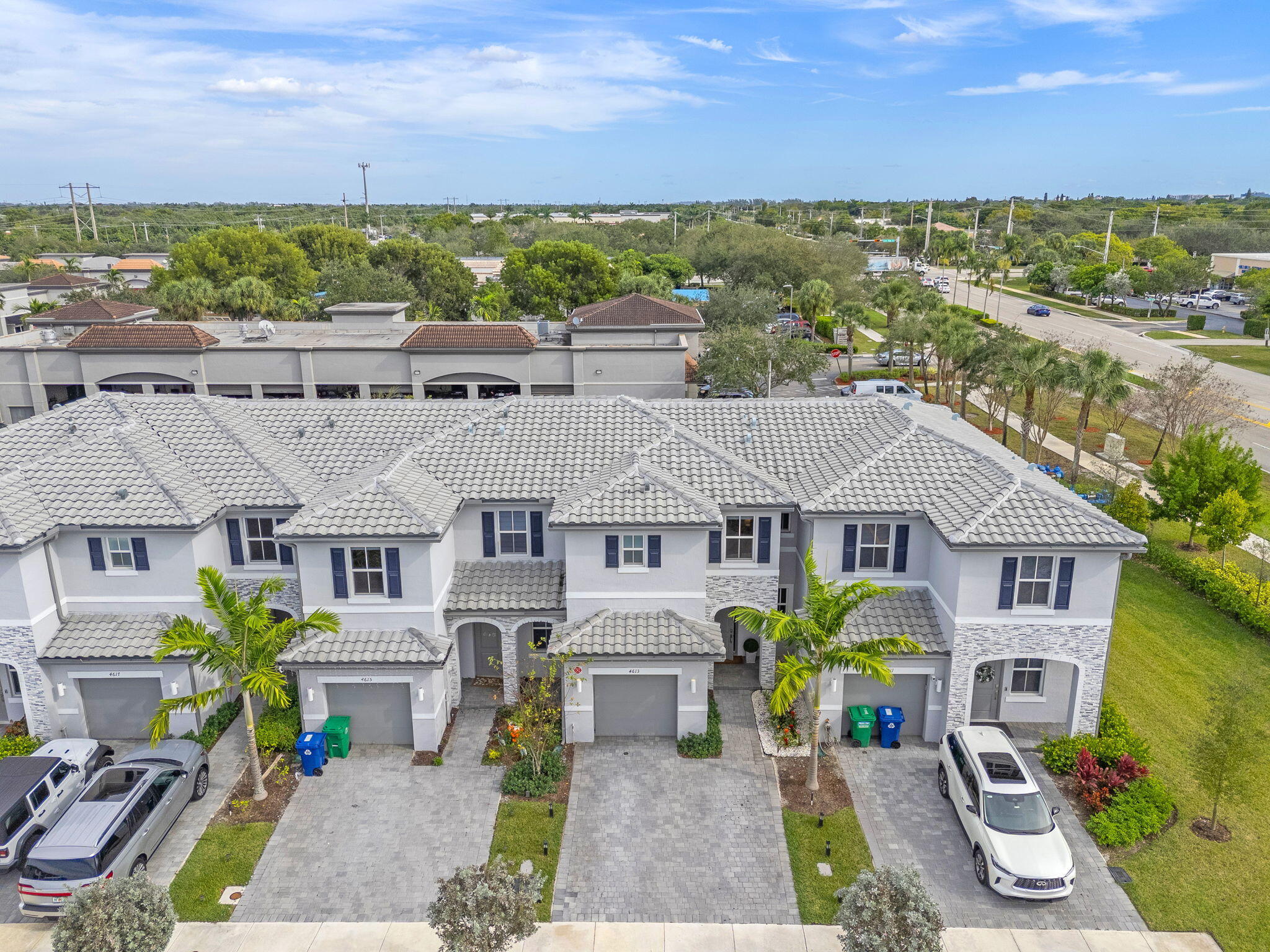 Beautifully designed two-story home in Coral Springs, FL, within Sunset Trails community  A welcoming foyer that opens into a bright, open-concept living space featuring a modern kitchen, cozy dining nook, and a spacious Great Room, perfect for entertaining or relaxing. The living area seamlessly extends to a private backyard patio, complete with artificial turf for a lush, low-maintenance outdoor space  Upstairs, you'll find two bedrooms on one side, while the owner's suite is privately situated across the hall, offering a comfortable retreat with its own en-suite bathroom and walk-in closet. One-car garage, two outdoor parking spaces, FPL electric vehicle charger  Access to excellent amenities, including a scenic walking trail, resort-style pool, jacuzzi, and a kiddie park