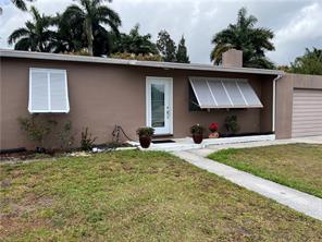 Great for your family.  As you enter the home, the welcoming living room has a fireplace and new ceramic tile floors.  The open concept home allows you to entertain in the kitchen while they dine at the counter. The recently renovated kitchen has new appliances, cabinets and countertops.  The Florida room has been enclosed for more living area.  Three bedrooms and one bathroom. One car garage with laundry room.  Air conditioner less than 5 years old, water heater less than 6 years old. Ceramic Tile throughout.   Oversized lot with plenty of room to expand.  Enclosed yard with mango trees. House is offered AS-IS.