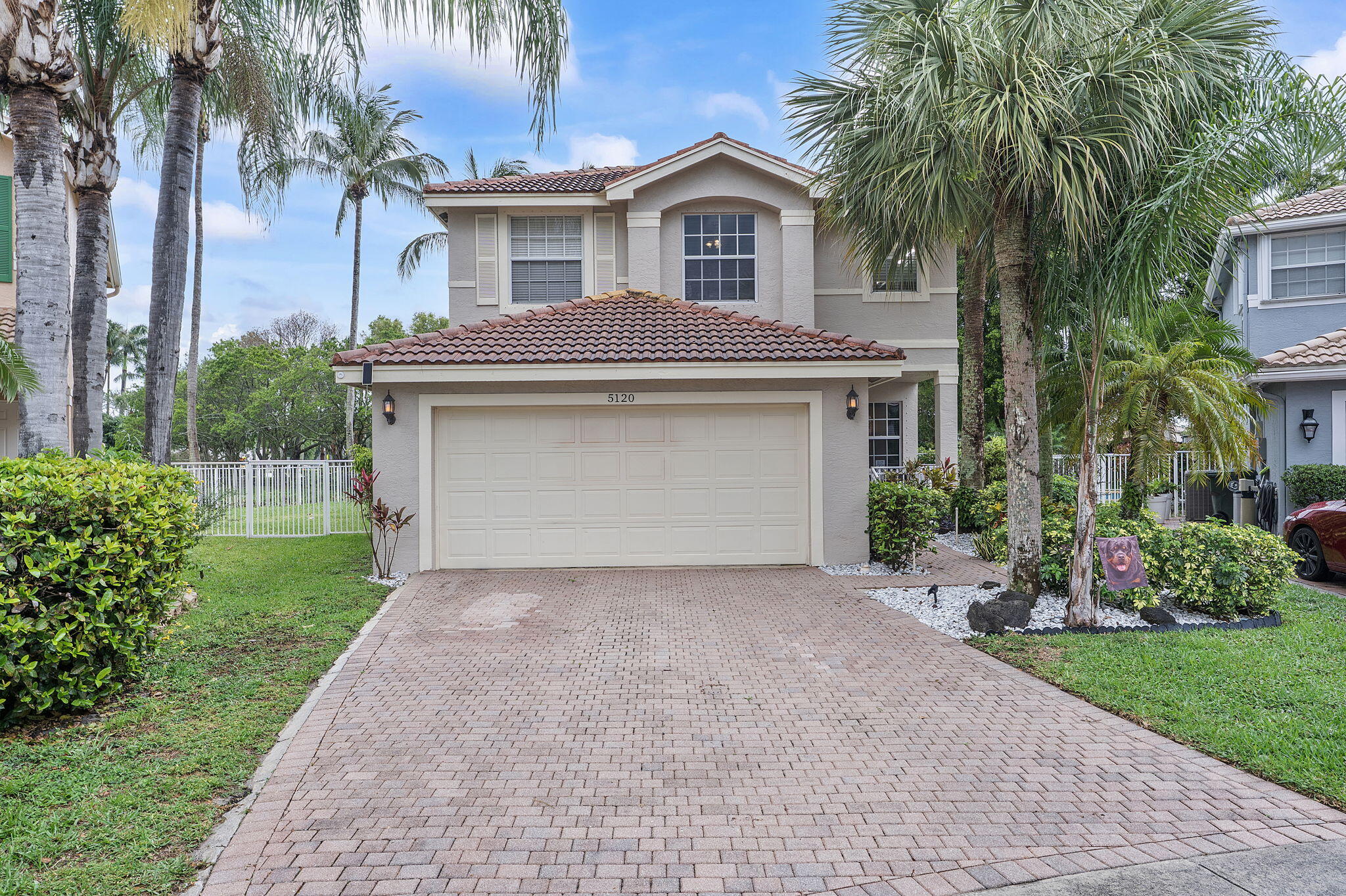 Set on a quiet cul-de-sac, this 4-bedroom, 2-bath  home offers the kind of space, privacy, and setting that's hard to come by. The oversized yard with a fully enclosed Pool.  Inside, the layout is open and practical, with a spacious living area that flows easily into the dining space, ideal for both daily living and entertaining. The kitchen is equipped with stainless steel appliances, ample cabinetry, and a cozy breakfast nook with plantation shutters that bring in great natural light.   The primary suite is designed for comfort, featuring a large en-suite bathroom complete with a Roman tub, separate walk-in shower, and plenty of space to unwind. The additional bedrooms are well-sized and versatile, whether for guests, a home office, or other uses.  Step outside to a screened-in pool with a full enclosure and paver deck, giving you a private outdoor retreat perfect for relaxing or hosting. The expansive backyard offers plenty of room beyond the pool, all while overlooking the water for added tranquility.  Parking is convenient with a 2-car attached garage and space for 2-4 additional vehicles in the driveway.  Located within a gated community, residents enjoy access to a wide range of amenities including a community pool, gym, tennis courts, pickleball courts, basketball courts, and a kiddie pool. The home is also within walking distance to three schools and just minutes from shopping, dining, and the beach—making everyday living both convenient and enjoyable.