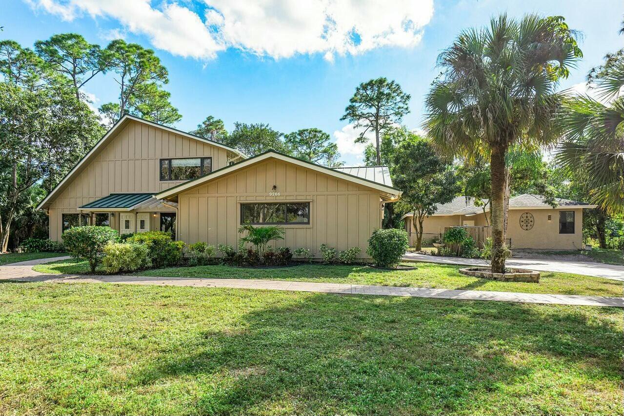 One of Kind 2 Homes,  Beautiful treed acre lot in Desirable Ranchettes with NO HOA, city water, paved roads in a sought after community.  Plenty of room to add on a large garage/workshop or barn or just lots of relaxing green space.  Main home is a 2 story with MBR downstairs large walk ins, spacious bathroom separate tub, shower. 4th bedroom downstairs split plan, oversized laundry room lots of storage. Formal Dining , living, and large family room, open kitchen, pantry,  roofed covered patio.  Head upstairs to 2 separate rooms and large bathroom double sinks along with a outdoor open deck with private entrance overlooking a shared gazebo perfect for entertainment.  Guest house is NEW shows like a model 3/1 over 1400 LA.  Impact Windows, Roof 2015, 2 separate septics. three way fenced.  Upstairs A/C 2026, guest house A/C 2024, Unlimited possibilities. Live in one home Airbnb the other for $400. night sought after by Equestrian people who fall in love with the privacy or great for a business or big family.