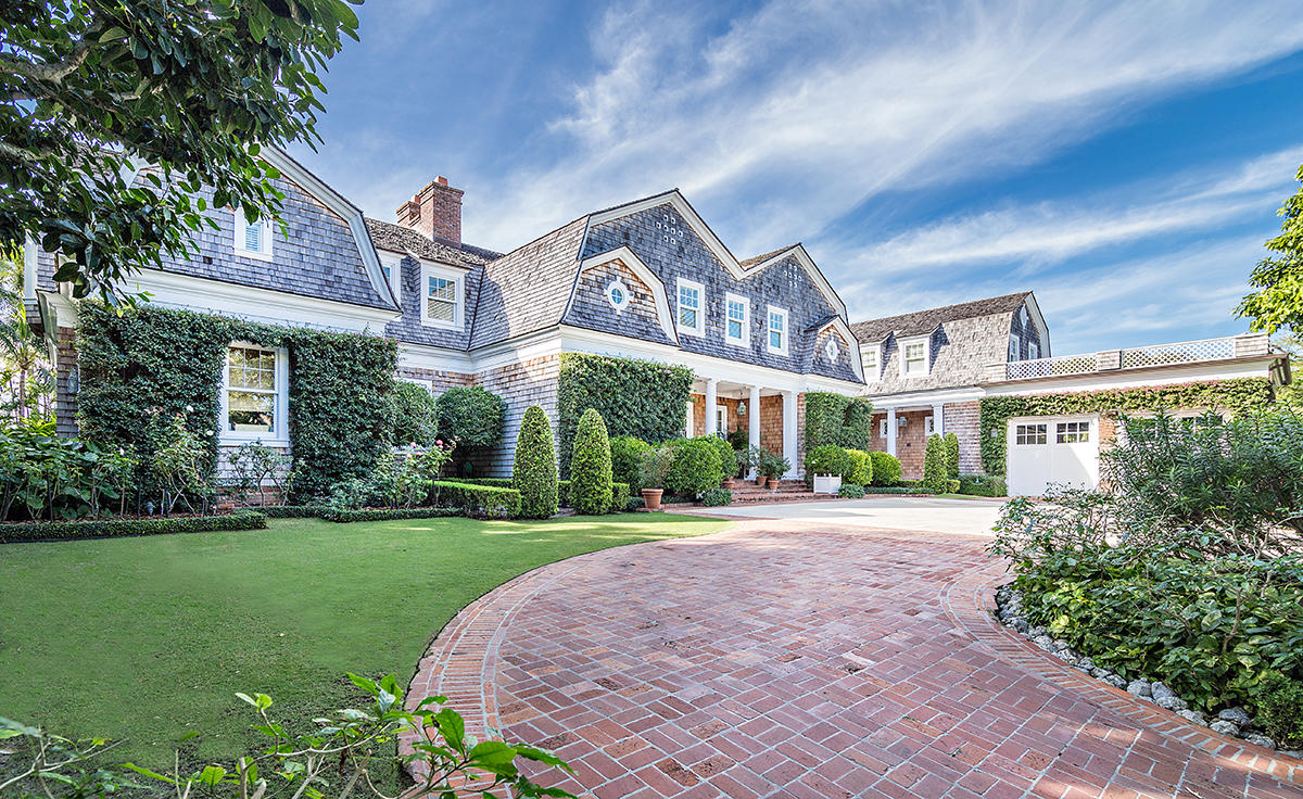 Built in 2003 to the highest standards, this impressive lakefront estate is characterized by high ceilings, deep overhangs, large porches, and numerous windows taking in spectacular Intracoastal Waterway and sunset views. Perfect for entertaining, the grand two-story living room has a soaring gabled ceiling with wooden beams and elegant details. Expansive second-floor windows flood the room with natural light. The home is designed for an indoor-outdoor lifestyle, with the main living spaces flowing out to porches with relaxing sitting areas overlooking 165 ft. of lntracoastal frontage, beautifully landscaped grounds, and the sumptuous pool. Boasting 9,878 sq ft of interior space, the house has five bedrooms, seven full baths and four half baths, separate staff quarters, and a spacious two-car garage. A deep-water dock can accommodate a boat of up to 100 ft., and there is also deeded access to the oceanfront beach cabana at Mockingbird Trail, making the most of this exquisite location.