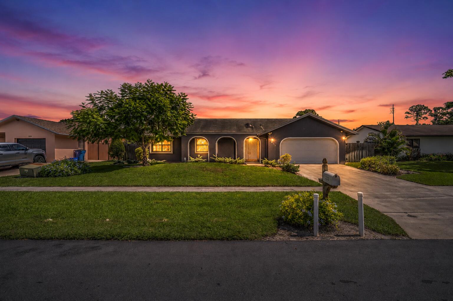Welcome to this charming 3/2 single-family home in the heart of Royal Palm Beach with no HOA and 2 Car Garage. This home offers a spacious floor plan designed for comfortable living and entertaining. The large living areas flow seamlessly into the kitchen and dining spaces, while the generously sized bedrooms provide plenty of room for family and guests. Step outside to enjoy the expansive open patio overlooking the fully fenced backyard, creating the perfect setting for outdoor gatherings, pets, and play. Roof 2002, A/C 2018, and WH 2018. While the home features carpeting it offers an opportunity for cosmetic updates. It is priced accordingly and provides an excellent opportunity for buyers to personalize & update to their taste. Located near parks, shopping, dining and schools!  A fantastic opportunity to own a home in Royal Palm Beach with no HOA restrictions at an affordable price!