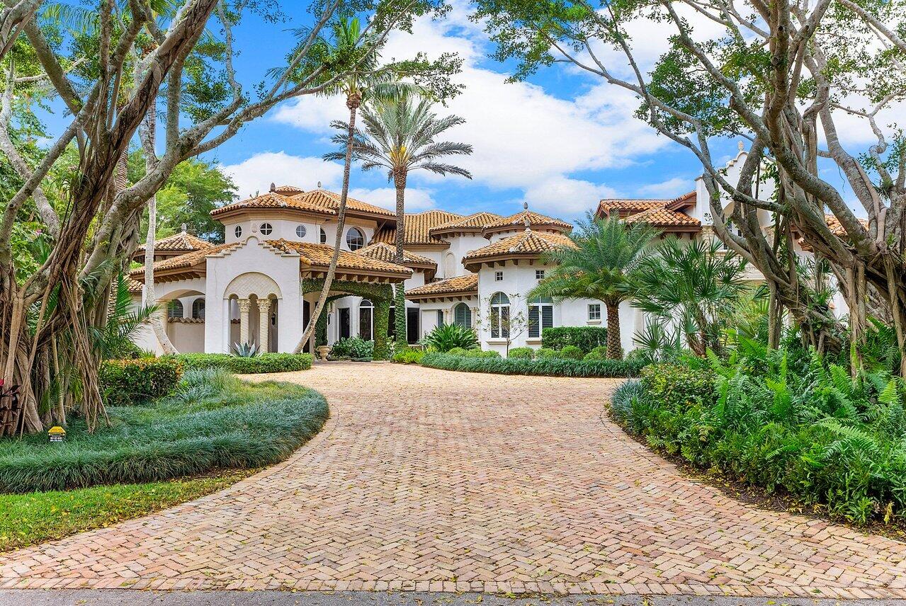 Few residential properties complement their natural surroundings like this 10,500 sf estate home. A tennis lover's dream with a private court, and endless panoramic lake view and the best lot in the community. The Living room has one of the largest living/entreating rooms you've ever seen. Home features 7 bedrooms, a library, two lofts & 9.2 bathrooms. Designed by Shane Ames & built by Classic Homes South, this masterpiece boasts up to 28' vaulted ceilings, custom molding, a chef's dream kitchen, and wide open living spaces with long lake views from every room. The 1st floor primary bedroom is its own wing of the home, with 2 bathrooms, walk in closets, sitting area, laundry, and a den/study. Also on the main floor are 2 guest bedrooms & office/library. Upstairs has 3 bedrooms & 2 Lofts All 7 bedrooms have en-suite bathrooms. Above the 4-car garage is a secluded living suite with a living room, bedroom and private bathroom. New Roof in 2019+ impact windows + full house generator + 5 new AC units. The custom home is situated on the BEST lot in Long Lake Estates, a desirable private, non-membership gated community in central Boca, located close to all the A Rated public and Private Schools. Floor Plan attached + video available