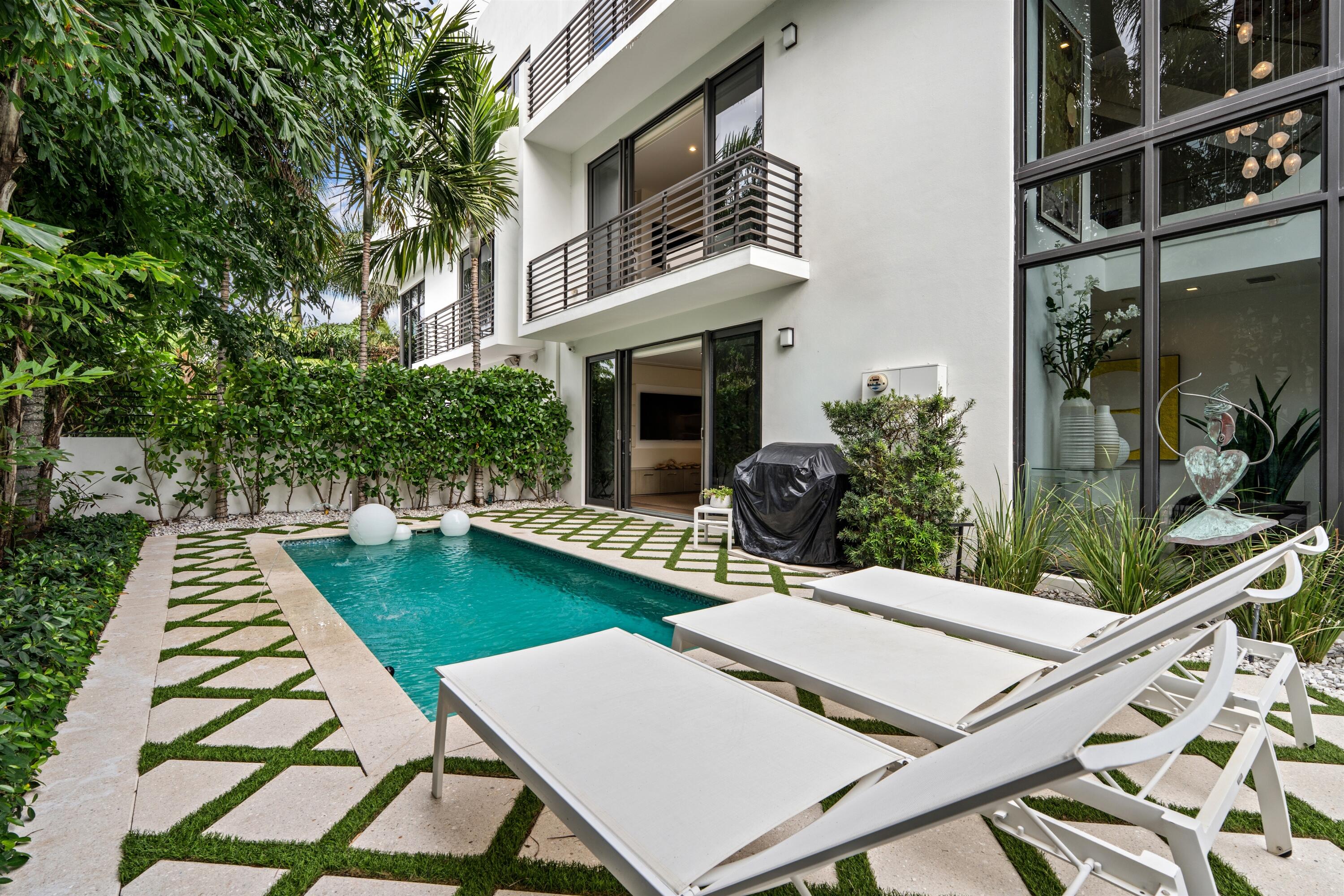 Built in 2017, this chic contemporary-style four-story townhome at the 150 Oceanside development features a spectacular two-story glass wrapped foyer atrium, a landscaped courtyard pool area, and on the fourth floor, a secluded rooftop deck offering ocean views. Sited in a perfect Delray Beach location, the townhome is one block from the ocean and two blocks from the heart of downtown. 152 Andrews Drive, Delray Beach, Florida: Within a secure and affluent north beach neighborhood, 150 Oceanside, an enclave with six townhome residences, brings modern luxury living to Delray Beach in grand style, situated one block from the beach and two blocks from the boutiques and eateries on vibrant downtown Atlantic Avenue.   PROPERTY:    Offering seamless indoor/outdoor living, this luxury townhome features a tropically landscaped gated courtyard that extends to the side terrace with a jetted plunge pool. The private fourth-floor rooftop deck, overlooking panoramic ocean-to-city views, features wood- and porcelain-tile flooring and includes a full-service summer kitchen with a grill, refrigerator and sink.   RESIDENCE:   For sophisticated seaside intown living, this chic three-bedroom contemporary townhome, with 5547+/- total square feet, showcases a dramatic two-story atrium foyer wrapped in floor-to-ceiling impact glass that enhances and elevates the entry. For indoor/outdoor entertaining, just adjacent on the first floor is the club room appointed with a built-in media center, wet bar fitted with a refrigerator and wine cooler, and floor-to-ceiling sliding glass doors that access the beautifully landscaped pool terrace. On the second floor, the great room, comprising living and dining areas, features bespoke built-in cabinetry that incorporates a biofuel fireplace and impact-glass sliding doors that access a treetop-view balcony. In an open-concept layout, the adjacent Kitchen Art island kitchen is fitted with sleek contemporary custom cabinetry, quartz countertops and Miele appliances. Also on this level are a guest bedroom suite with sliding doors to a private sunrise balcony, a half bath and laundry room. On the third floor, the primary suite and the guest bedroom suite both access private balconies. The bedroom of the primary suite features bespoke custom cabinetry that incorporates upholstered wall panels, desk, nightstands and headboard. Completing the suite are a custom-fitted walk-in closet and a bathroom finished with dual sinks, custom cabinetry, quartz counters, soaking tub, walk-in shower, and a water closet with a Toto toilet. Details throughout include wood-plank flooring, impact-glass windows and doors, custom tile in the bathrooms, a generator and three Carrier air conditioners, while completing the layout are an elevator and attached two-car garage with epoxy flooring. This elegant residence is sure to please! Enjoy salt air and ocean breezes, with terraces and balconies that offer indoor/outdoor living on every level!  DISCLAIMER: Information published or otherwise provided by the listing company and its representatives including but not limited to prices, measurements, square footages, lot sizes, calculations, statistics, and videos are deemed reliable but are not guaranteed and are subject to errors, omissions or changes without notice. All such information should be independently verified by any prospective purchaser or seller. Parties should perform their own due diligence to verify such information prior to a sale or listing. Listing company expressly disclaims any warranty or representation regarding such information. Prices published are either list price, sold price, and/or last asking price. The listing company participates in the Multiple Listing Service and IDX. The properties published as listed and sold are not necessarily exclusive to listing company and may be listed or have sold with other members of the Multiple Listing Service. Transactions where listing company represented both buyers and sellers are calculated as two sales. "No payments made until title passes" Some affiliations may not be applicable to certain geographic areas. If your property is currently listed with another broker, please disregard any solicitation for services. Information published or otherwise provided by seller, listing company or its representatives is deemed reliable but are not guaranteed and subject to errors, omissions, or changes without notice. Copyright 2026 by the listing company. All Rights Reserved.