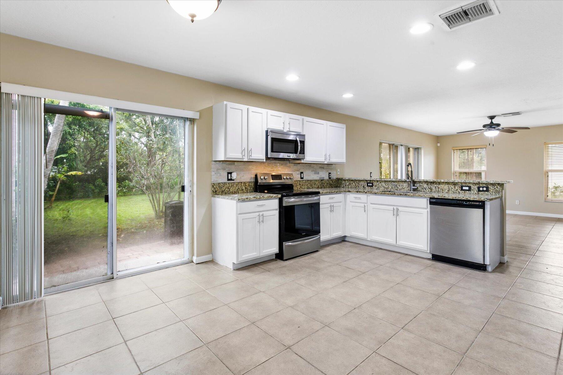 Rarely available for lease in the desirable gated community of Borgata in Melear.  This spacious 4-bedroom, 2.5-bath residence offers comfort, functionality, and an exceptional location. One of the best values currently available in central Boynton Beach. Situated on an oversized pie-shaped cul-de-sac lot, the home features a generous private backyard and open patio, Ideal for outdoor enjoyment, entertaining, or simply relaxing in privacy. Inside, soaring volume ceilings create an airy first impression in the main living area, while tile and laminate flooring throughout provide both style and easy maintenance. The thoughtfully designed floor plan offers an open-concept layout connecting the renovated kitchen, dining area, and family room, creating a seamless flow for everyday living.  Glass sliders invite natural light and provide direct access to the patio for effortless indoor-outdoor living. The updated kitchen is well-equipped with ample cabinetry, built-in microwave, and functional workspace for cooking and gathering. Upstairs, all four bedrooms are privately situated, including a spacious primary suite designed for comfort and retreat. Additional features include a 2-car garage with automatic opener, interior laundry room with washer and dryer, Accordion Shutters, A/C 2018, Water Heater 2022, and 4-zone sprinkler system.  Homes of this size and value in Borgata are rarely available.    Residents of Borgata enjoy access to excellent community amenities including a fitness center, pool, picnic area, playground, and sidewalks throughout the neighborhood. Conveniently located near major roadways, shopping, dining, top conveniences, and just minutes from the beach and vibrant downtown Delray Beach, this home offers the best of South Florida living.