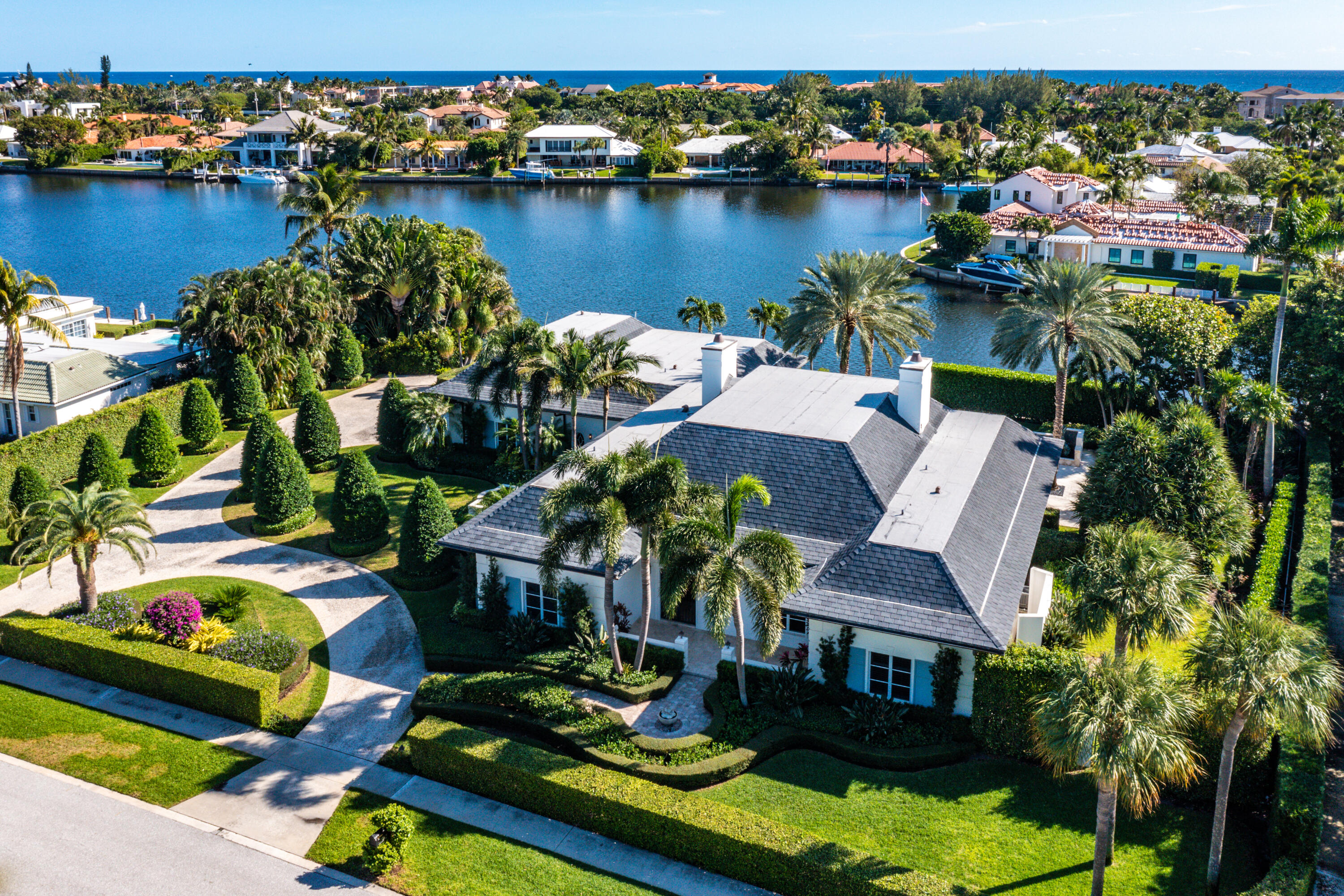 1500 Lands End is an incredible opportunity to own one of the largest and rarest lots in Point Manalapan. Your Beautiful Seaside Estate is sited on nearly 30,000 sqft featuring over 200ft of water-frontage, an 80ft dock and sprawling across roughly 4400 living sqft. The lush, mature landscaping, private pool, serene water views & French Bermuda style architecture captivate all you are looking for with coastal, island living. Enjoy your built-in Summer Kitchen, spacious 3-car garage, oversized circular driveway, whole house generator & high impact hurricane windows and doors throughout. Relax & Socialize with your Gratis Membership to La Coquille Club at the EAU Spa and Resort just minutes away, and included as a homeowner in the sought after "Manatee Cove" of Point Manalapan.  Let this Crown Jewel be yours today! This one truly is  .. A must see! *PLEASE SEE AERIAL VIDEO ATTACHED AS WELL*