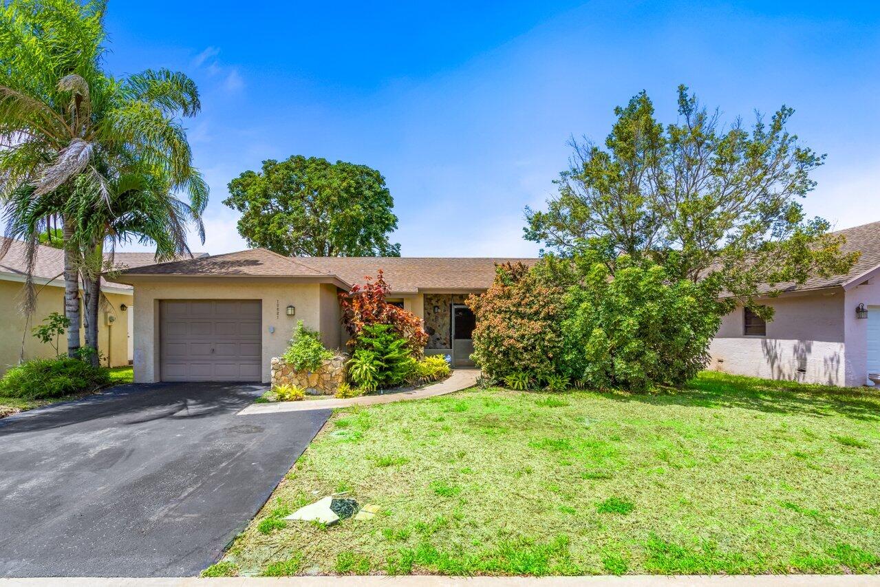 Discover a charming retreat set within the 55+ active adult community of Greenbriar at Boca Chase! This home strikes the perfect balance of cozy and spacious, featuring 2 bedrooms, 2 bathrooms and a den that can be easily converted to a 3rd bedroom. The open concept floor-plan allows for various living space configurations best suited to your needs. Exterior features include a covered lanai, open patio and attached one-car garage. Boca Chase offers residents a centrally located clubhouse, swimming pools, tennis, pickleball and basketball courts, fitness room and more!