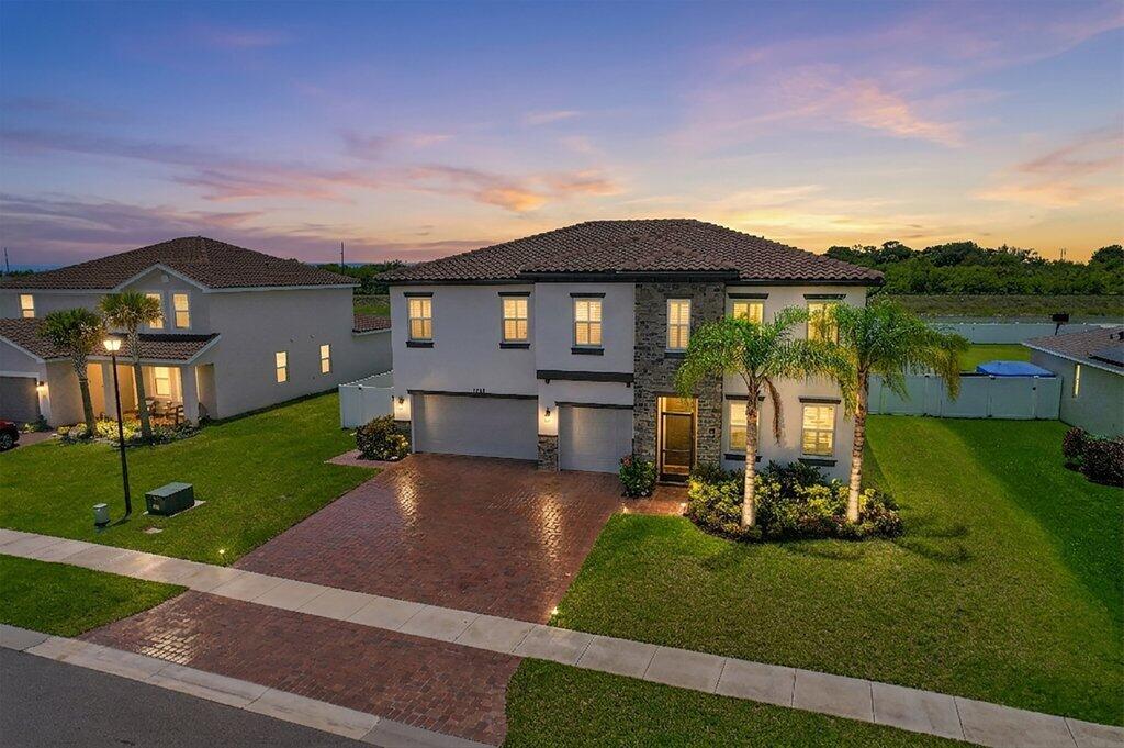 Experience luxury and space in this stunning 2022-built Olympia model featuring 5 bedrooms, +office, 4 bathrooms, and a 3-car garage. Offering 3,367 square feet of thoughtfully designed living space, this home sits on over 1/3 of an acre and showcases an exceptional blend of comfort, functionality, and modern style.  Step outside to your private backyard retreat complete with a spacious heated saltwater pool, oversized spa, sun shelf, screen enclosure, and an expansive 600+ square foot lanai—perfect for entertaining or relaxing year-round. Inside, the open-concept floorplan provides seamless flow for everyday living and hosting guests. The main-level bedroom and full bath create an ideal setup for guests or multigenerational living. Upstairs, the versatile loft... offers endless possibilities as a media room, secondary living area, playroom, or flex space. The oversized primary suite delivers a true retreat with abundant space, a large walk-in closet, and a spacious ensuite bathroom designed for comfort and convenience. This home is fully equipped with premium smart-home technology including professionally installed concealed cable wiring, a Moen Smart Water system, Nest smart thermostats, dual-zone A/C, and a high-end security system for added peace of mind and efficiency. Located in the highly desirable Copper Creek community, residents enjoy resort-style amenities including a community pool, clubhouse, fitness center, and playground—all with a low HOA fee. Ideally situated near shopping, restaurants, the New York Mets spring training facility, Cleveland Clinic, and top-rated schools just minutes away, this home offers the perfect combination of luxury, convenience, and lifestyle.