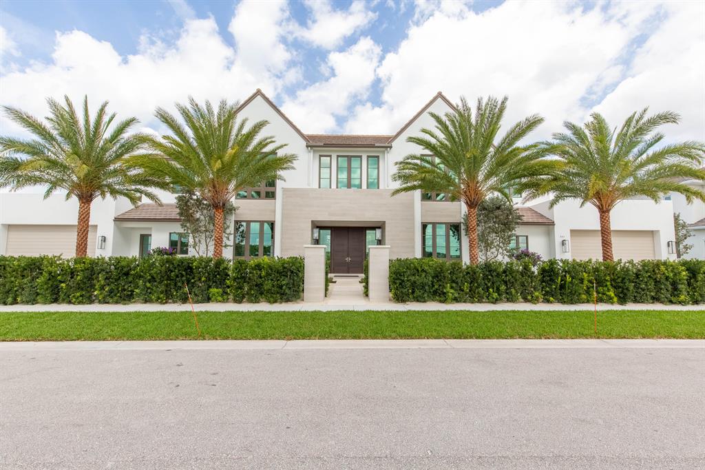 This stunning new custom build is situated in the heart of Palm Beach Polo on a highly-sought after waterfront lot. Enjoy captivating views of the 11th hole on the Cypress course and 92-acre natural preserve from the luxurious pool and covered lanai. Inside, the one-of-a-kind modern design boasts over 7,400 square feet of living space with 6 bedrooms and 7 and a half bathrooms. The Tudor inspired roofline and floor-to-ceiling windows create dramatic spaces, filled with tons of natural light. The main level is complete with beautifully appointed master suite, a guest suite, a library, and two wine rooms adjacent to the formal dining room. Upstairs you are greeted with even more breathtaking views from the loft, 3 additional guest bedrooms and a VIP suite with a large balcony.