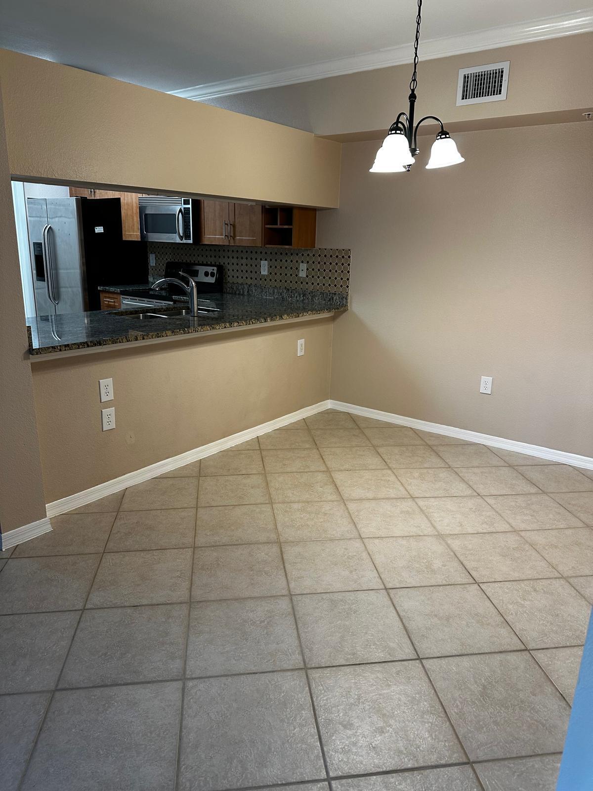 NOW AVAILABLE!! Experience modern living in this beautifully renovated 2-bedroom, 2-bath condo on the second floor with 2 assigned parking spaces, featuring sleek tile flooring throughout. The kitchen shines with stainless steel appliances and granite countertops, while ceiling fans in every room keep the space cool and comfortable. This move-in-ready unit offers peaceful views from your private balcony, large walk-in closets, and a convenient laundry room with a pantry. The condo also boasts elegant crown molding throughout. This resort-style community offers a wealth of amenities and is ideally located near the Turnpike, downtown West Palm Beach, I-95, shopping malls, and dining options, from casual to fine dining. No Pets Per Owner.
