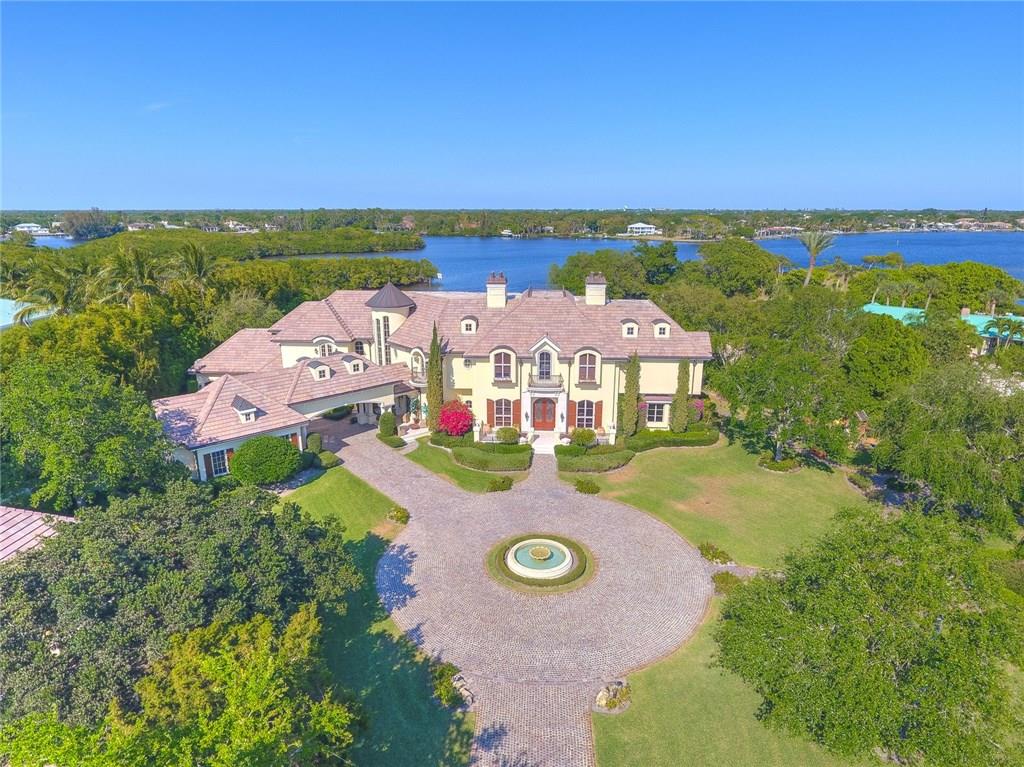 Unique residence for those who appreciate privacy, luxury and perfection. European design palatial style in 4 acres estate on almost 300' of Waterfront with ocean access. Privately gated luxury residence includes guest house, lighted tennis/basketball court, a modern resort style large pool, wet bar with grill and spa, 8 bedrooms, 7.5 baths, large gourmet chef's kitchen, home theater, entertainment room, master suite complete with fireplace and private waterfront balcony, gym, impact resistance doors and windows, detach 3 cars garage with bedroom, studio/storage house, security cctv system, alarm, 2 emergency generators and water tanks.
