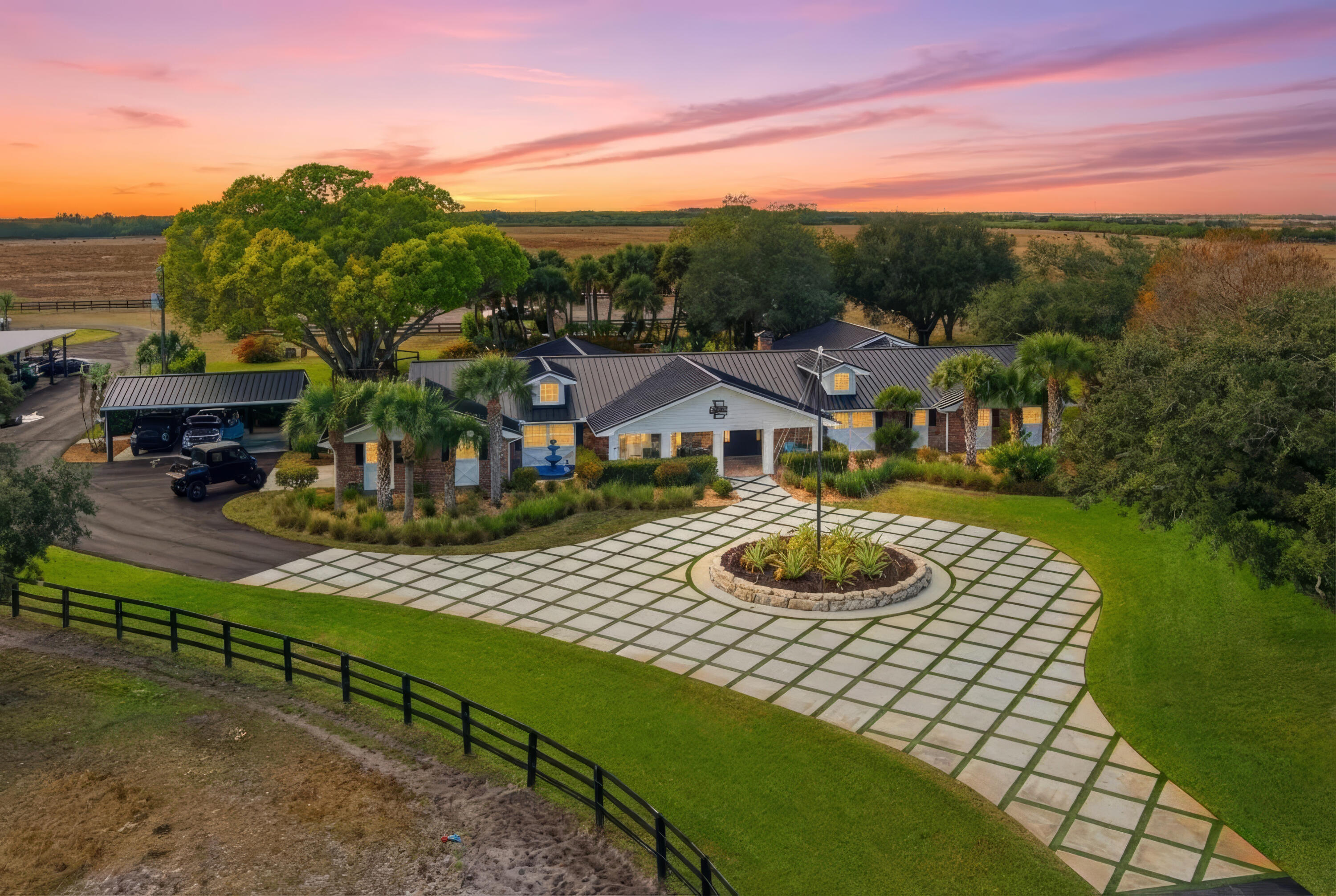 Set on 10 pristine acres, this extraordinary estate seamlessly combines luxury living with equestrian excellence and resort-style outdoor amenities. The main residence features five bedrooms and five and a half bathrooms, designed with an open-concept floor plan perfect for both everyday living and entertaining. Highlights of the home include a whole-house propane generator, full impact windows, spray foam insulation throughout, a new metal roof, a 1,000-gallon propane tank, three fireplaces, and a custom entertainment center complete with a built-in TV, accent lighting, and surround sound distributed throughout.

The spacious primary suite offers a private sitting room, a dedicated library, and custom built-in shelving. The living area features sliding accordion doors that open seamlessly onto the covered back porch, creating an effortless indoor-outdoor lifestyle.

Outdoors, you'll find a true private retreat, featuring a resort-style pool with a waterfall, an infinity hot tub that accommodates eight people, and a fully equipped outdoor kitchen with a built-in bar, grill, and smokerideal for entertaining guests.

The equestrian facilities are second to none, boasting a six-stall horse barn complete with an air-conditioned tack room, a full bathroom, and a washer and dryer. Above the barn, there is a rider's suite fully equipped with one bedroom and a full bath apartment. The property also includes a fully irrigated riding arena equipped with LED lighting for day or night use.

Additional structures include a separate gym stocked with full equipment, mini-split A/C, a stereo system, and a 100-inch TV. Storage and vehicle accommodations are plentiful, featuring a three-truck carport, a two-car garage, and an impressive 10,000-square-foot air-conditioned pole barn/shop with car lifts. This shop can accommodate a 40-foot boat and a 40-foot camper, along with two lean-tos measuring 20 feet and 50 feet on each side.

This one-of-a-kind property offers ample space, privacy, and unmatched amenitiesmaking it ideal for equestrian enthusiasts, hobbyists, and those seeking a luxurious lifestyle without compromise.
