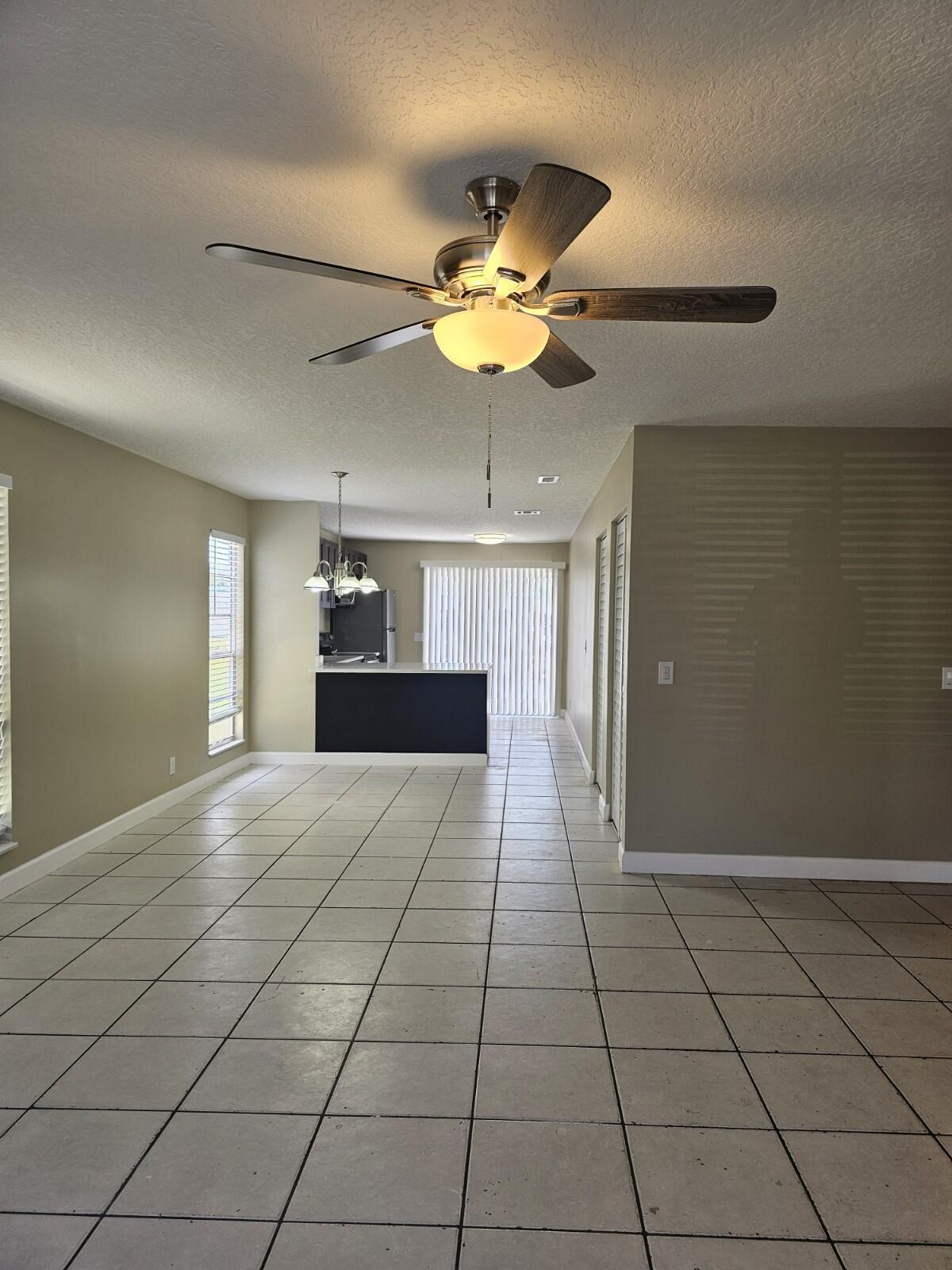COMPLETELY RENOVATED and freshly painted corner townhouse filled with natural light! This spacious 3-bedroom, 2-bathroom home offers 1,320 sq ft of living space and is in EXCELLENT CONDITION, located in an investor-friendly community — rent it from day one for an estimated $2,400/month, with a low HOA of only $304/month. Enjoy a KITCHEN featuring beautiful cabinets, GRANITE COUNTERTOPS, and NEWER STAINLESS STEEL APPLIANCES. The home also includes a NEWER FULL-SIZE WASHER & DRYER. Both bathrooms have been fully renovated, and ceramic tile flooring extends throughout. Decorative ceiling fans add a stylish and functional touch. Conveniently located just minutes from the Turnpike, I-95, and downtown for easy commuting and access to nearby amenities. Don't miss out on this amazing opportunity —