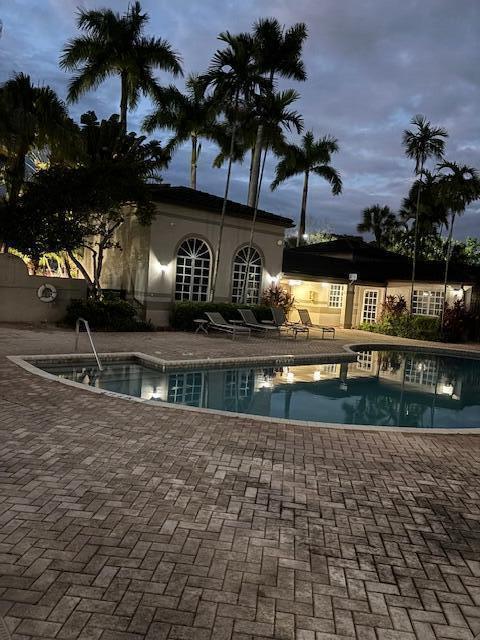 Desirable Villas De Venezia Community has a Resort-Style Setting.  Enjoy the Serene Lake View in this beautiful First Floor Condo Featuring 2 bedrooms/2 bathrooms with Tiles throughout, Granite Countertops in the Kitchen and a Full-Sized Washer and Dryer in the Unit.  Amenities include a Clubhouse, Tennis Courts, Pools, Playground and a Gym.  The Complex is conveniently located near Public Transportation and Shopping Areas.  Association States a Minimum Credit Score of 600 is Required. Investor-Friendly Community.  All ages are welcome!