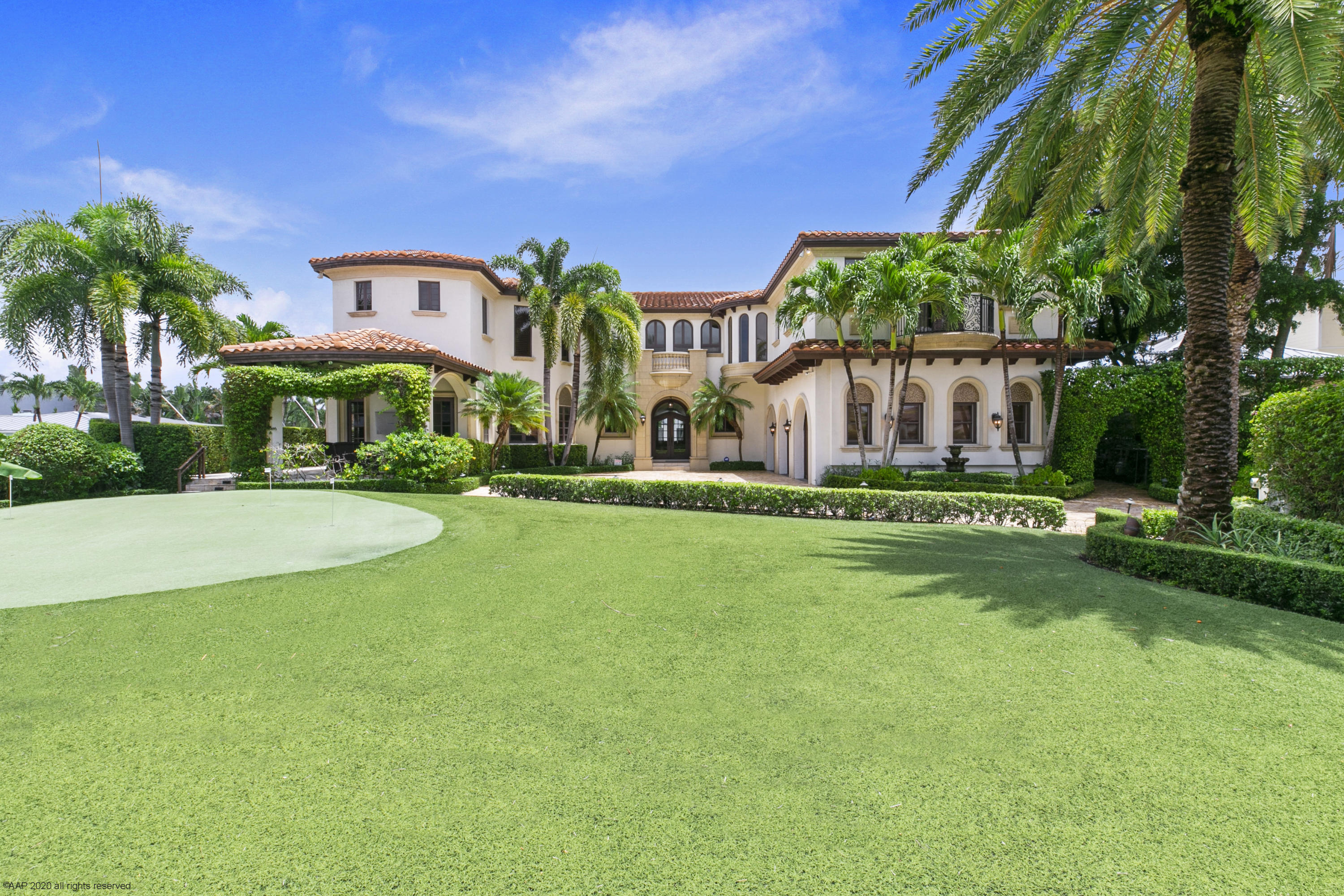 Special offering of TWO deepwater lots.  Residence is on the point lot and artificial turf putting green occupies the buildable adjacent lot (116 ft on water, separate tax bill) totaling approx 300 ft of waterfront and 1/2 acre of land.  Residence main floor extras consists of office with built-ins, theater room, wine storage room, pub room (man cave) with billiard table, seating area with TV and bar, guest bedroom with ensuite bath.  Gourmet kitchen with center cooking island  (natural gas),  loads of storage, and custom new appliances make entertaining a delight. Living room with fireplace, formal dining room, powder room, and waterside family room complete the downstairs. Polished marble and Brazilian cherry wood flooring are throughout the home. The 2nd floor, accessible by elevator or stairs, consists of loft living room, laundry room,  4 guest bedrooms with ensuite bathrooms, and spacious master suite, with fireplace, overlooking the resort like pool/spa and waterway.  Full house generator, 4 newer AC units, SWAT bug system, salt water pool and spa, outdoor grill,  3 car tiled garage and spectacular waterfront dock (6ft wide, ample electricity, on batter pilings) fit for a yachtsman, all combine to make this estate one of a kind.
 
Sold in AS-IS condition for the owner's convenience. .