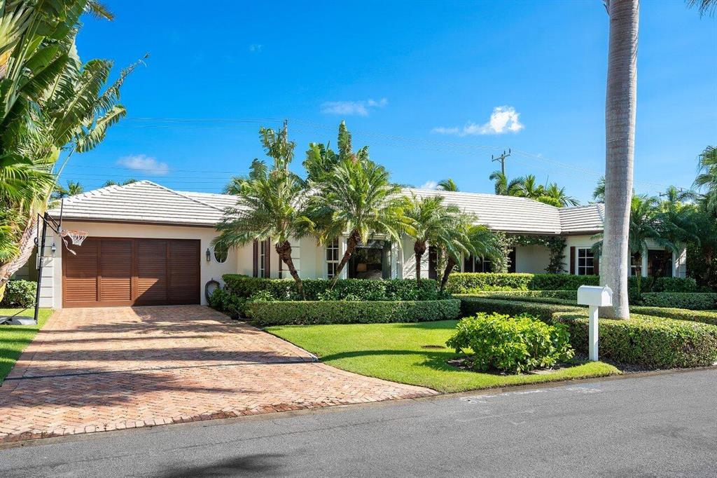 Fabulous north end 4BD/4BA 1 story home on an exclusive royal palm tree line street, featuring beautifully decorated bedrooms, limestone, hardwood floors, chef's kitchen, a 400 bottle wine cellar, hurricane impact windows & doors and a 2 car garage.  Close access to the lake trail.  The ultimate turnkey waiting for you!