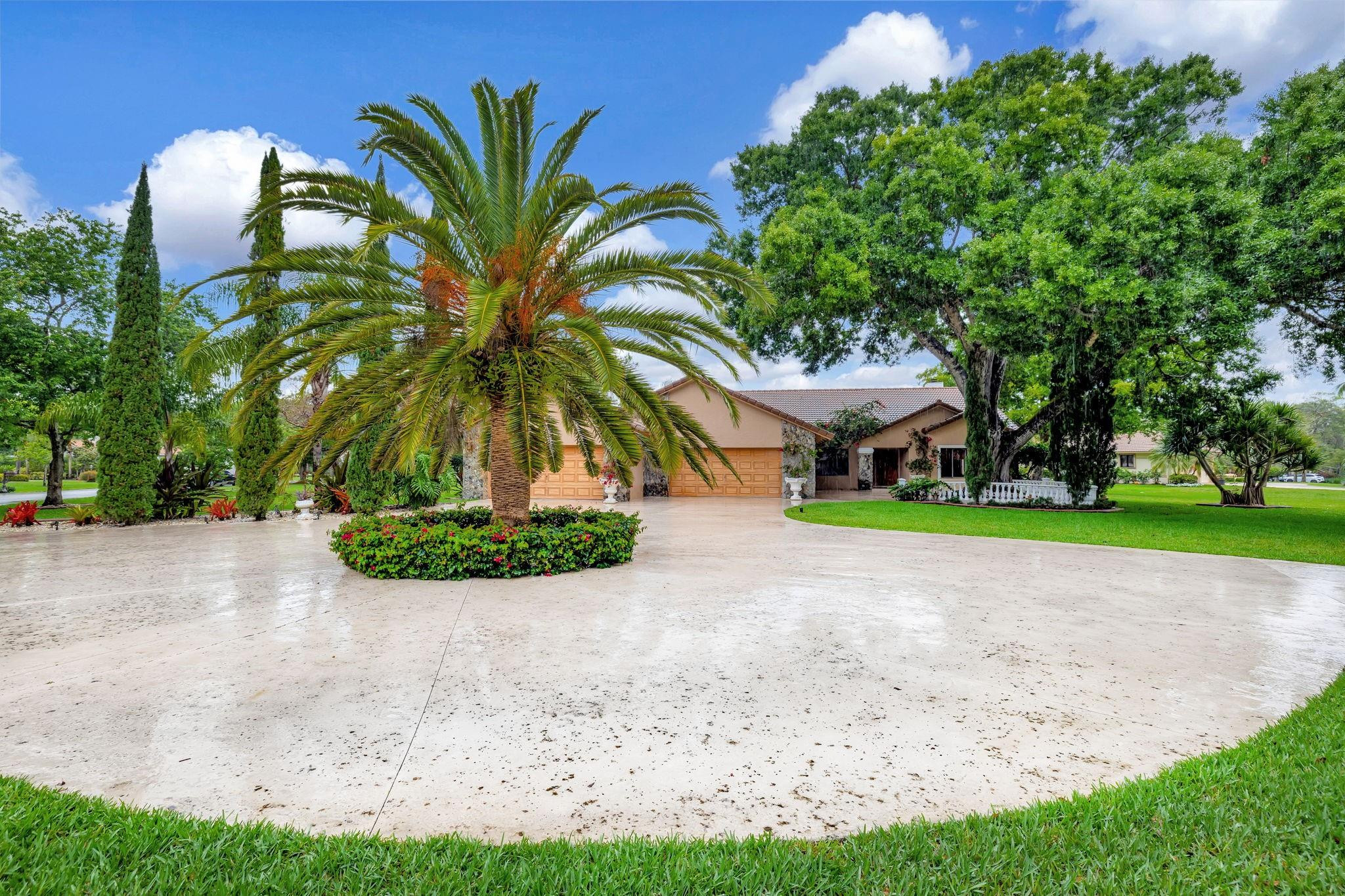 WOW, HUGE PRICE REDUCTION!!  6 AIR CONDITIONED GARAGES! SET ON OVER AN ACRE CORNER LOT, THAT PROVIDES LOTS OF ROOM FOR MULTI-GENERATIONAL EXPANSION. , HUGE CONCRETE CIRCULAR DRIVE, LOVELY MATURE LANDSCAPING & OUTDOOR LIGHTING. CUSTOM ELEGANCE, FEATURES BEAUTIFUL STONE FLOORS,  WOOD BURNING FIREPLACES, ONE IN THE FAMILY ROOM & ONE IN THE PRIMARY SUITE.  WHITE KITCHEN WITH GRANITE COUNTERS, 3 A/C SYSTEMS, WHOLE HOUSE CENTRAL VAC, VOLUME SMOOTH CEILINGS. SCREENED IN POOL/PATIO, WITH OVERSIZED DECK & PERFECT FOR ENTERNTAING PATIO KITCHEN INCLUDES, BBQ, ELECTRIC OVEN, REFRIG, & SINK. WHISPERING WOODS IS A GUARD GATED COMMUNITY WITH ESTATE SIZE HOMESITES AND FABULOUS MATURE LANDSCAPE. COME MAKE THIS SPECIAL HOME & PROPERTY YOUR VERY OWN.