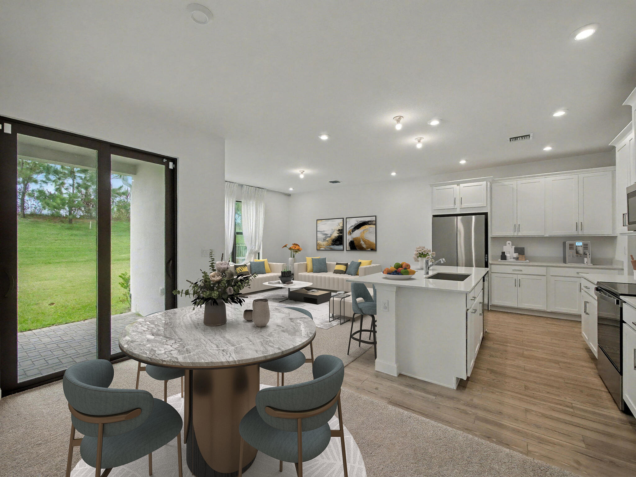BACK ON MARKET due to Buyer Financing falling through. Welcome to modern living in Cadence at Tradition! This beautifully updated 3-bedroom, 2.5-bathroom townhome showcases a clean, sleek contemporary design with stylish finishes and thoughtful upgrades throughout. Step inside to an open and inviting floor plan, where natural light highlights the modern aesthetic and well-appointed living spaces. The upgraded kitchen is a standout feature, offering contemporary cabinetry, elegant countertops, and a seamless flow into the dining and living areas—perfect for both everyday living and entertaining. A brand-new refrigerator will be installed post-closing, adding even more value and convenience. Enjoy low-maintenance living in one of Tradition's most desirable communities. The HOA fee includes cable, high-speed internet, lawn care, landline phone service, gated security, and access to a recreational facility complete with a pool and cabana—delivering both convenience and value.  Upstairs, the spacious bedrooms provide comfort and privacy, including a well-designed primary suite with a generous layout and a beautifully appointed en-suite bath. A king bed in the primary bedroom can convey with the sale, if the buyer so desires. The additional bedrooms are ideal for guests, a home office, or flexible living space.  Enjoy low-maintenance living in one of Tradition's most desirable communities. The HOA fee includes cable, high-speed internet, lawn care, landline phone service, gated security, and access to a recreational facility complete with a pool and cabana—all just a short walk from your front door.  Ideally located just minutes from shopping, dining, and major highways, as well as the Cleveland Clinic Tradition Hospital, this home offers the perfect blend of modern design and everyday ease.