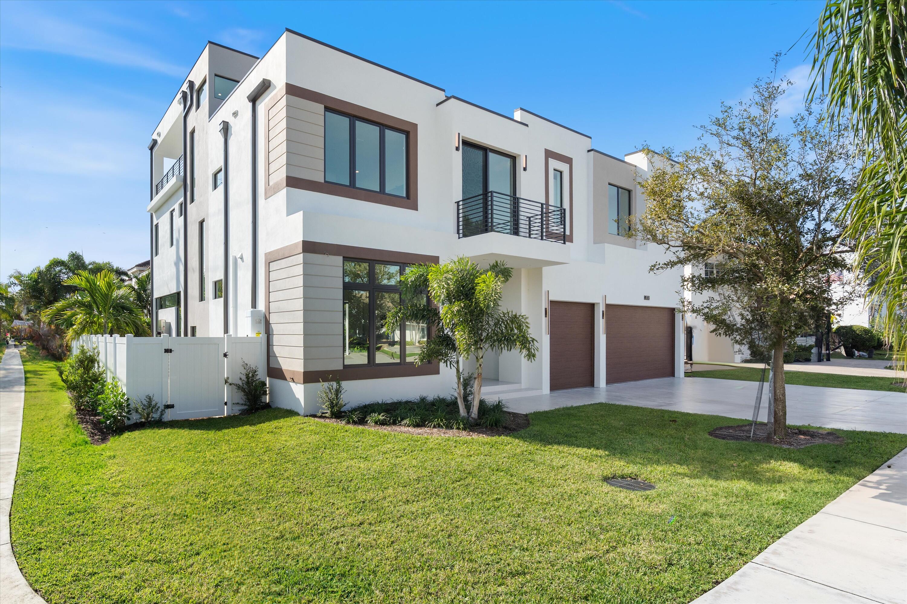 New Construction Completed and Ready for Occupancy! Redefining modern luxury in East Boca's coveted Golden Triangle, this 5BD/6.5BA residence is set on a premium corner lot just steps from the beach, Mizner Park, Royal Palm Place, The Boca Raton Club, and downtown shopping and dining. Thoughtfully designed for comfort and entertaining, the home features 11-ft ceilings, a sunlit open-concept great room, dining area, and chef's kitchen with waterfall quartz island, Wolf gas range, SubZero fridge, 2 Cove dishwashers, and walk-in pantry. Porcelain tile floors, glass-paneled staircase, and a club room with wet bar complete the 1st level. Covered patio and pool deck include a built in grill and a heated Diamond Brite pool with spa. Upstairs: 9-ft ceilings, oak floors, 3 en-suite bedrooms plus a spacious master suite with sitting area, 2 walk-ins, spa-style bath with soaking tub, dual vanities & water closets. Inviting 2nd floor lounge with balcony. Elevator to all 3 levels including a 3rd-floor clubroom with bar, powder room, and SE-facing terrace with sunrise views. 3-car garage with epoxy flooring, laundry rooms on 1st & 2nd floors. Pre-wired for Smart home automation.

Redefining Modern Luxury in East Boca's Coveted Golden Triangle
Welcome to a rare opportunity to own a new construction masterpiece in the heart of East Boca Raton, where sophisticated design meets effortless coastal living. Developed by Zanzibar Capital and custom built by Beach to Bay Custom Builders, a respected builder with a strong presence in the Golden Triangle and East Boca Raton. This five-bedroom, six and a half bath architecturally striking residence is perfectly sited on a premium corner lot in the highly desirable Golden Trianglejust a short stroll to the beach, the finest restaurants, vibrant Mizner Park, Royal Palm Place, The Boca Raton Club, and all that downtown Boca has to offer.

From the moment you arrive, this home captivates with its clean modern lines and curated finishes, thoughtfully designed for both elevated entertaining and day-to-day comfort. A rare gem boasting a third-floor clubroom with an expansive covered terrace, this residence offers a lifestyle as exceptional as its locationcomplete with sweeping views of the mansions lining the Intracoastal and an ever-present southeast breeze.

Step inside to soaring 11-foot ceilings and a sunlit, open-concept great room, kitchen, and dining area that seamlessly connects indoor and outdoor living. The chef's kitchen is a showpiece, featuring a large waterfall-edge quartz island, European-style cabinetry with warm organic tones, and a suite of premier appliances including a 6-burner natural gas Wolf range, SubZero refrigerator, and dual Cove dishwashers. A spacious walk-in pantry room off the kitchen adds to the functionality without sacrificing style. Floor-to-ceiling glass frames the lush backyard and south-facing pool deck, drawing in abundant natural light and setting the stage for resort-style relaxation. The covered patio and pool deck also include a built-in grill, ideal for alfresco dining and entertaining.

The first floor also features a private en-suite bedroomideal as a guest suite or officeas well as a stylish club room with wet bar, overlooking the pool for effortless entertaining. Porcelain tile floors enhance the flow and modern aesthetic throughout. A glass panel balustrade staircase leads to the upper levels, blending contemporary design with architectural elegance. Additional features on the first floor include a laundry room and a spacious three-car garage.

Upstairs, 9-foot ceilings and white oak flooring carry through to three additional en-suite bedrooms plus a show-stopping master suite with a serene sitting area, two expansive walk-in closets, and a luxurious spa-like bath with dual vanities, dual water closets, a freestanding soaking tub, and a grand walk-in shower. An inviting and spacious family lounge with balcony creates a second living space for relaxing, media, or play, while another en suite bedroom features a front-facing balcony with lush tropical views. A second laundry room on this level adds everyday convenience.

Every level of this residence is accessible by a sleek private elevator, including the incredible third flooryour blank canvas for a home gym, game room, theater, or ultimate party loungecomplete with a bar, powder room, and a stunning southeast-facing covered terrace for enjoying sunrise views and cooling ocean breezes.

The home is also pre-wired for Smart home automation, providing the modern convenience today's discerning buyers expect.

This is more than a homeit's a lifestyle. Whether entertaining poolside, unwinding on your private top-floor terrace, or strolling to dinner and live music downtown, this exceptional property redefines modern luxury in one of Boca Raton's most walkable, sought-after neighborhoods.

Disclaimer: The builder and/or seller reserve the right to modify architectural designs, specifications, features, finishes, colors, pricing, and layouts without prior notice. All renderings, floor plans, images, and videos are artistic representations for conceptual purposes only. While the information provided is believed to be accurate, it is not guaranteed and may be subject to errors, omissions, or changes. All measurements, dimensions, room sizes, and lot sizes are approximate and should be independently verified. Prospective buyers and sellers are encouraged to conduct their own due diligence to confirm any details important to them. The listing brokerage makes no warranties or representations regarding the accuracy or completeness of this information and expressly disclaims any liability arising from its use.