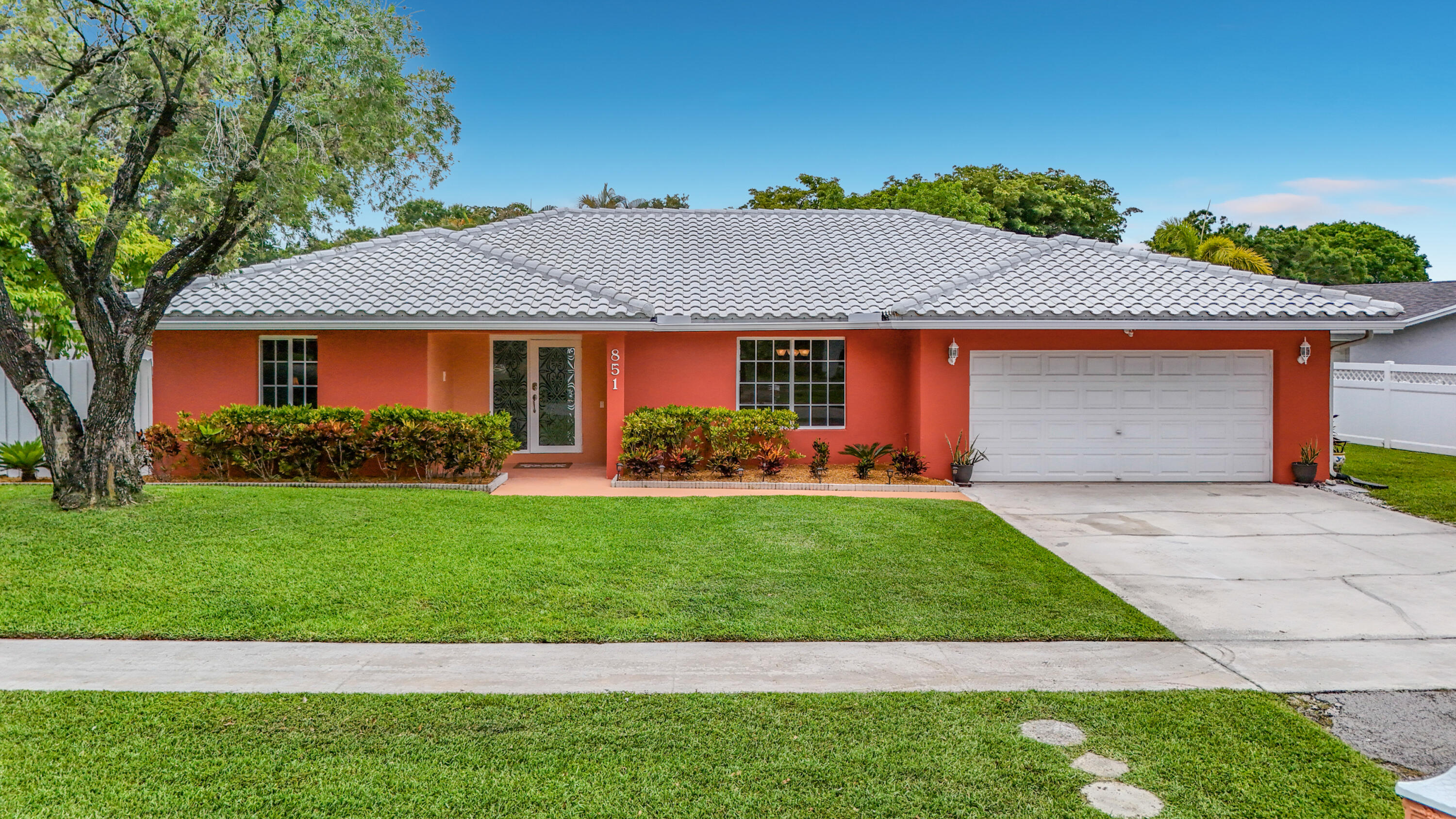 Beautiful, spacious, and rarely available 5-bedroom, 2-bath home in the highly desirable Plantation Hills community! This thoughtfully positioned residence features an open-concept floor plan with a chef-inspired kitchen, perfect for both everyday living and entertaining. Enjoy a split-bedroom layout offering privacy, amble sized bedrooms and closet space, with abundant natural light throughout. The home is equipped with impact windows and doors, roof with solar panels, and a screened-in pool set within a fully fenced yard—ideal for embracing the South Florida lifestyle. With no HOA, convenient access to shopping, dining, and major roadways, this home is ideally situated in a well-established neighborhood. Move-in ready and a must-see!