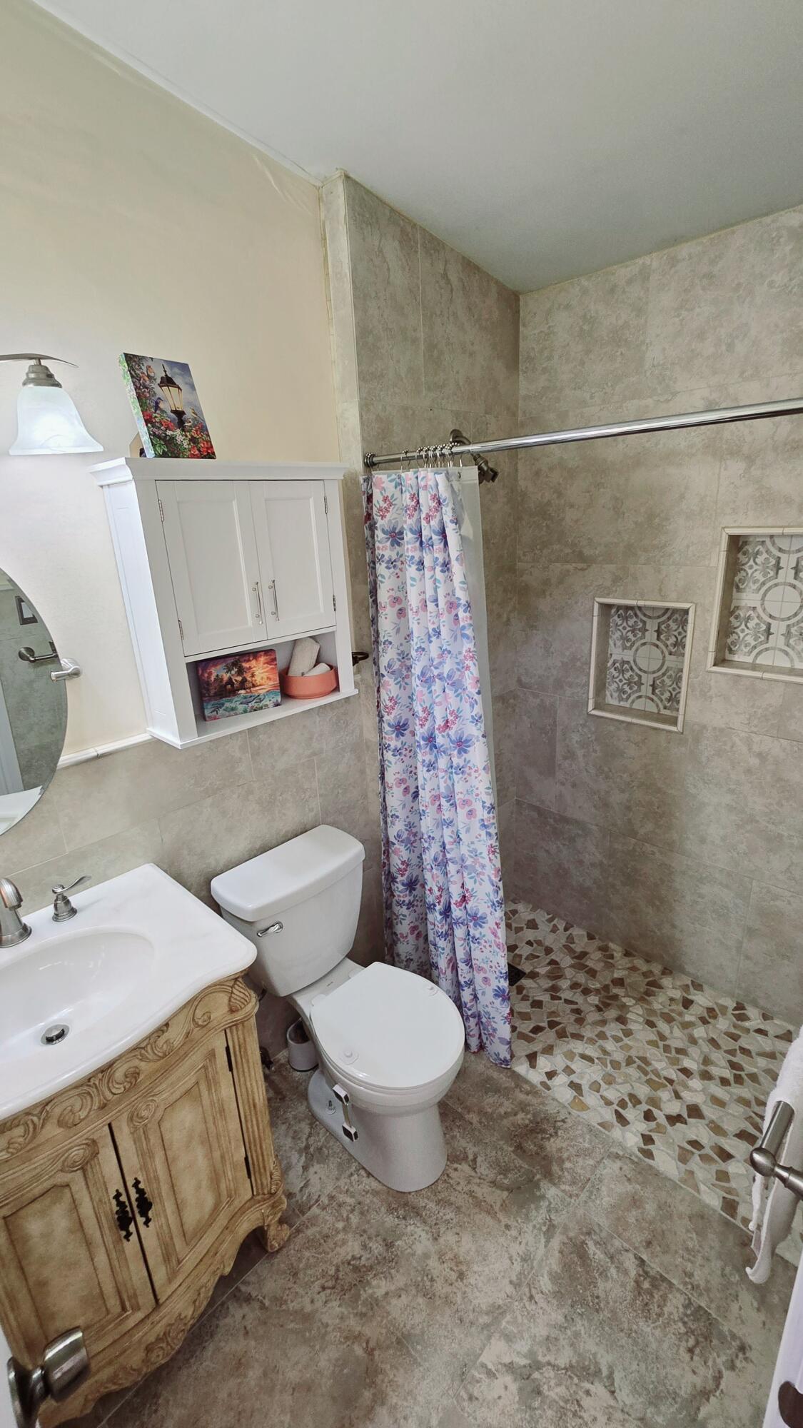 Fully remodeled 2/2 in the well-maintained Villager Townhomes community. This beautiful unit backs up to the preserve with lush greenery views and features a newly remodeled kitchen, marble floors throughout, remodeled bathrooms, vaulted ceilings, and washer and dryer in the unit. Enjoy an assigned parking spot right in front of the house with plenty of guest parking. The community/building has all new roofs, a pool, and lots of shade. Prime location minutes from I-95 and the Florida Turnpike, close to shopping, dining, parks, schools, and the beach. Hurry before this deal is gone!