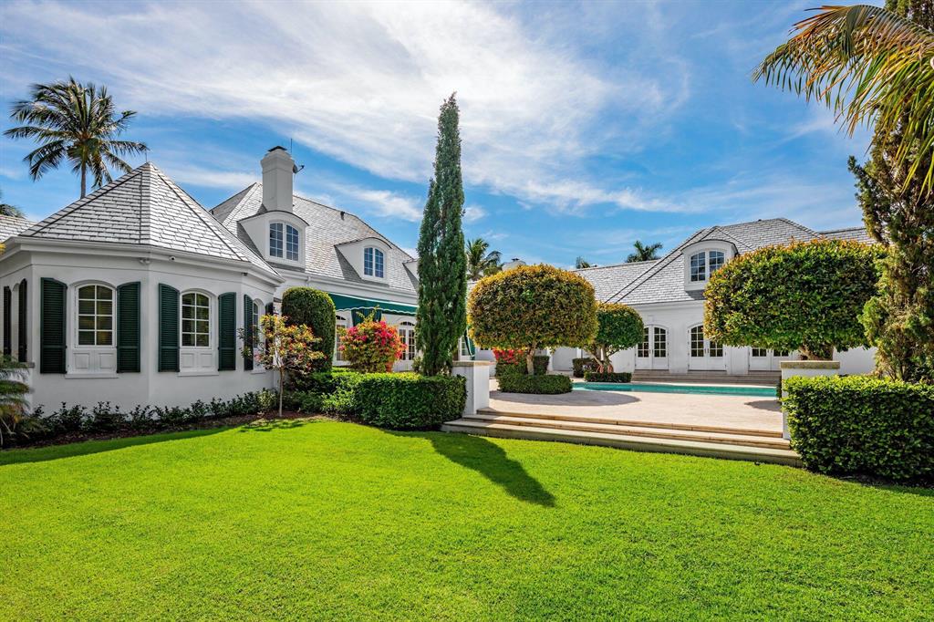 Sited in an incomparable setting in the heart of Gulf Stream, this elegant waterfront estate on Polo Cove surrounded by stately hedges and lush tropical landscape elegantly articulates the ideals of classic design. Affording the discerning buyer the ultimate privacy in the most sought after location in the area the home features 50' of water frontage on a protected cove. The residence boasts 7,689 total square feet, a separate guesthouse, 7 Bedrooms, 6.2 Bathrooms a new slate roof, dock and impact glass. The grand foyer with sweeping staircase opens graciously and flows effortless to a spacious and generous living area. The home is replete with a Chef's kitchen, 3 wood burning fireplaces a luxurious master suite with 2 baths an adjoining private library/office providing a perfect respite for the owners enjoyment.
 The secluded Zen like pool area create a peaceful space to entertain and enjoy the incomparable Florida lifestyle with family and friends.   This home is what you have been waiting for! Ideally located within 20 minutes of Palm Beach's International Airport or the Private Air Terminal of Boca Raton transportation is easily accessible.  World-class beaches of Gulf Stream and Delray are close by, as well as fine dining and shopping along famed Atlantic Avenue.